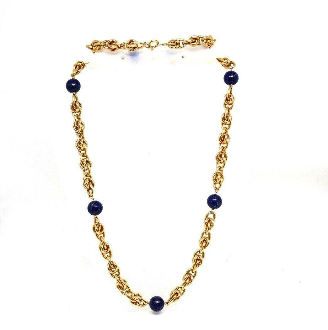 Gorgeous vintage (c.1970) 14k yellow gold necklace by Tiffany & Co. Features whimsical chain link and seven lapis lazuli beads. Stamped with the Tiffany maker's mark and a hallmark for 14k gold.
Measurements: 31