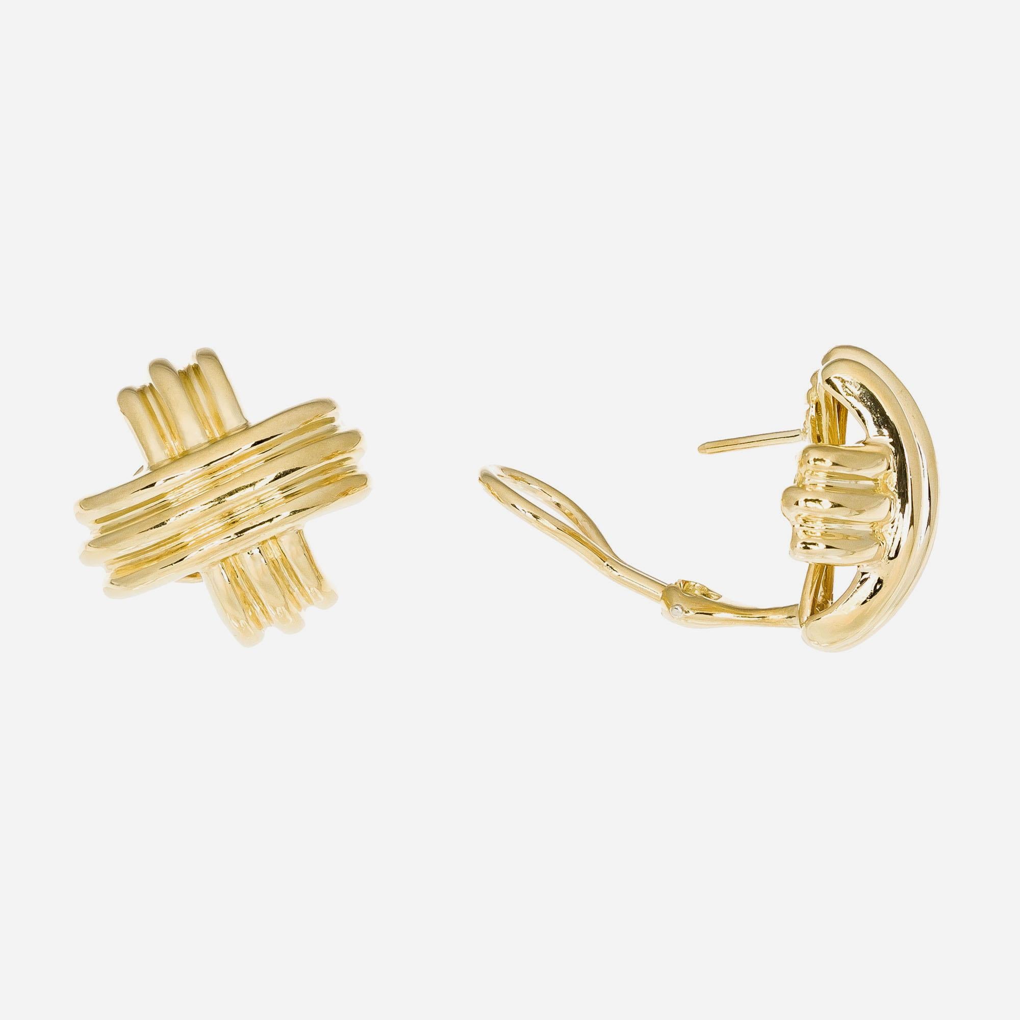 18k yellow gold Tiffany & Co “X” earrings designed in as a cross motif with posts and hinged omega backs signed T + Co and 750

18k yellow gold 
Stamped: 750
Hallmark: T +Co
13.9 grams
Top to bottom: 18.6mm or .75 Inch
Width: 19.5mm or .75