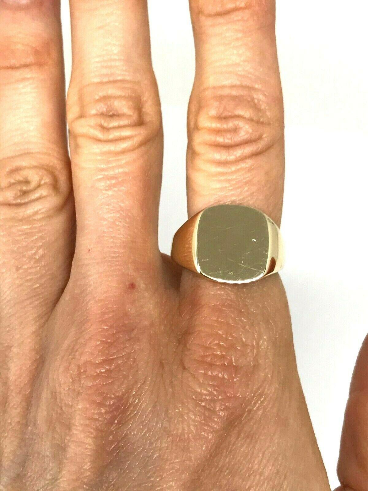 Tiffany & Co. signet ring made of 14k polished yellow gold, circa 1960s. 
Measurements: the ring size is 8.25. The signet is 5/8 H x 5/8 W, shank is 1/8
