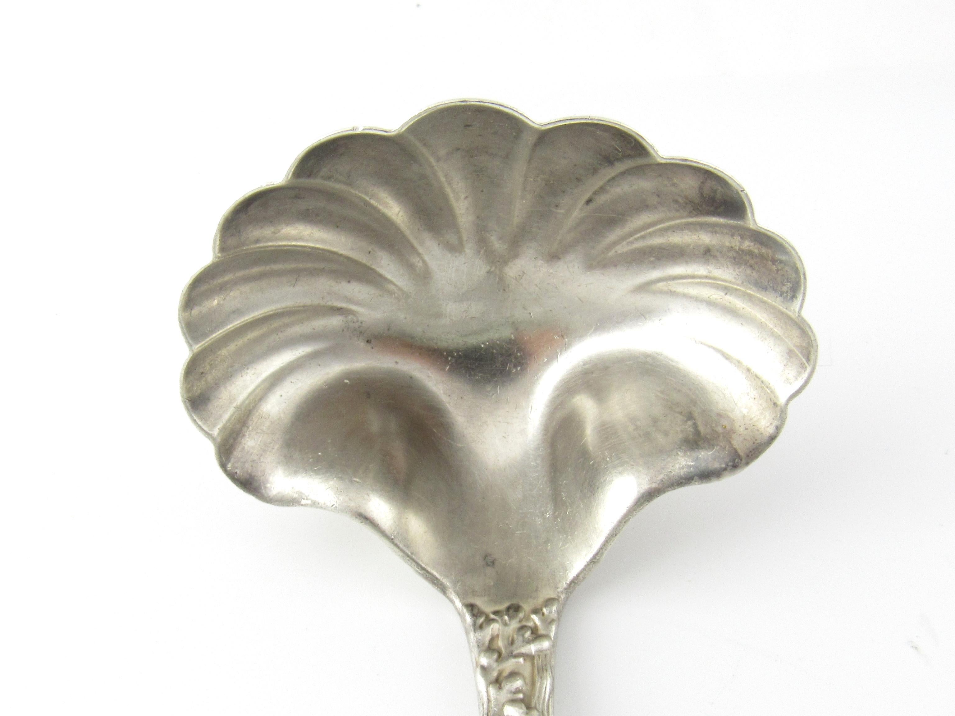 Tiffany & Co Wave Edge Sterling Silver Ladle with Monogram

This is a sterling silver soup ladle with shell bowl in the wave edge pattern made by Tiffany & CO.

Measurement: Measures 7 inches long and 11/16 inches at widest part on handle. Shell