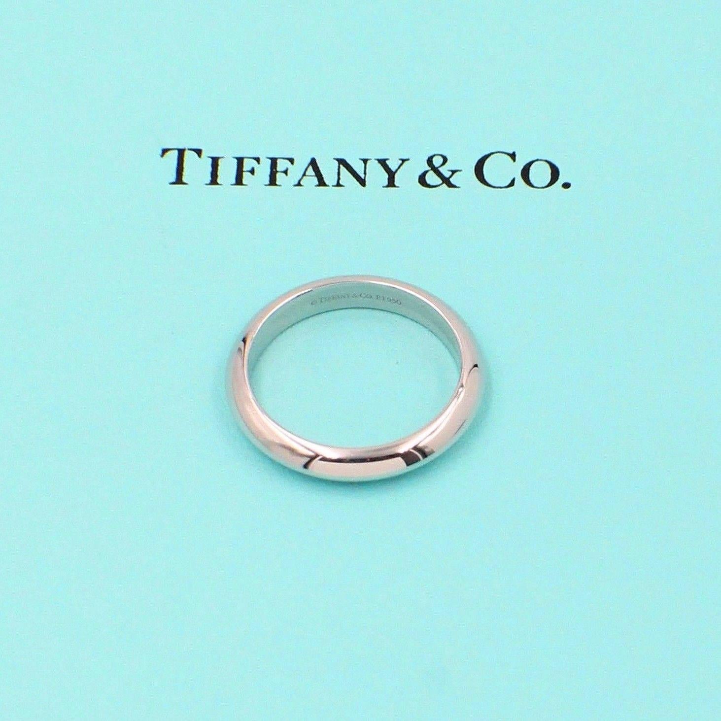 Tiffany & Co.
Style: Knife Edge Wedding Band
SKU Number:  27565751
Metal:  Platinum PT950
Size:  10.5 - sizable  
Width:  4MM  
Hallmark:  ©1999 TIFFANY&CO.PT950
Includes:  Tiffany & Co. Jewelry Pouch

Retail Value:  $1,500 + TAX = $1,616.75