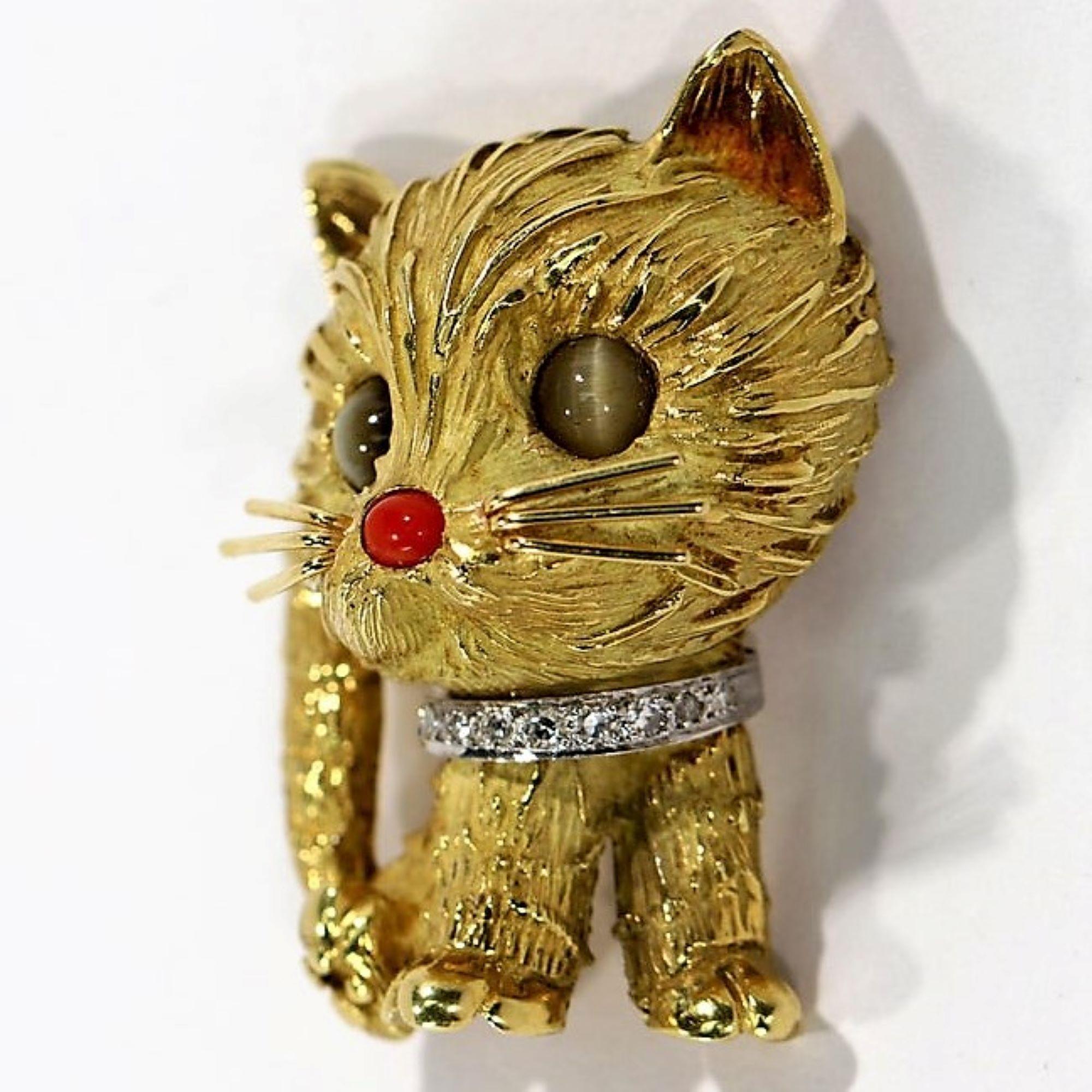 Absolutely adorable kitty cat produced by Tiffany & Co. in 18k yellow gold during the latter part of the 20th century. This wonderful brooch features beautifully detailed gold work highlighted by a coral nose, and diamond collar with a total weight