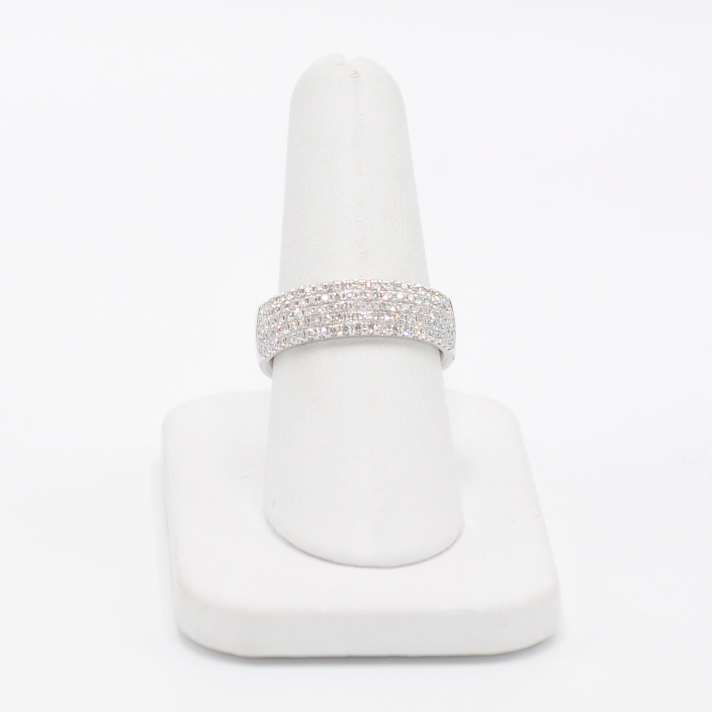 Beautifully brilliant Tiffany 18 Karat white gold pave diamond ring. Spanning from edge to edge .85cts of pave diamonds wrap half way around the ring. Add a little sparkle!

Stamped '©Tiffany&Co. 750 Belgium'

Size 8