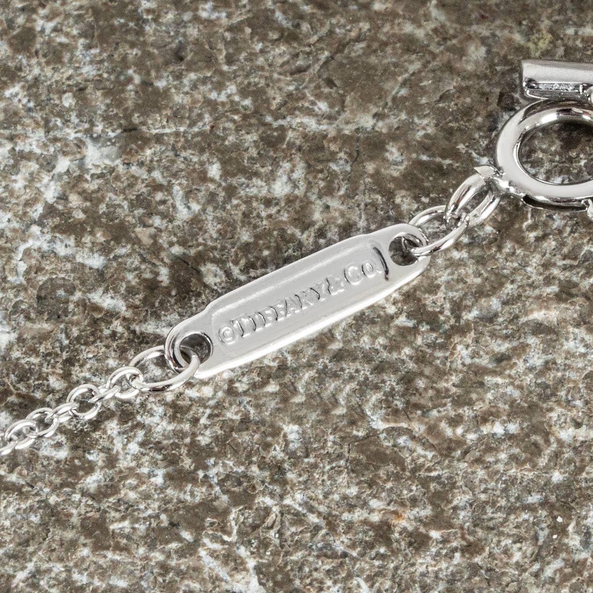 Round Cut Tiffany & Co. White Gold Diamond T Pendant For Sale