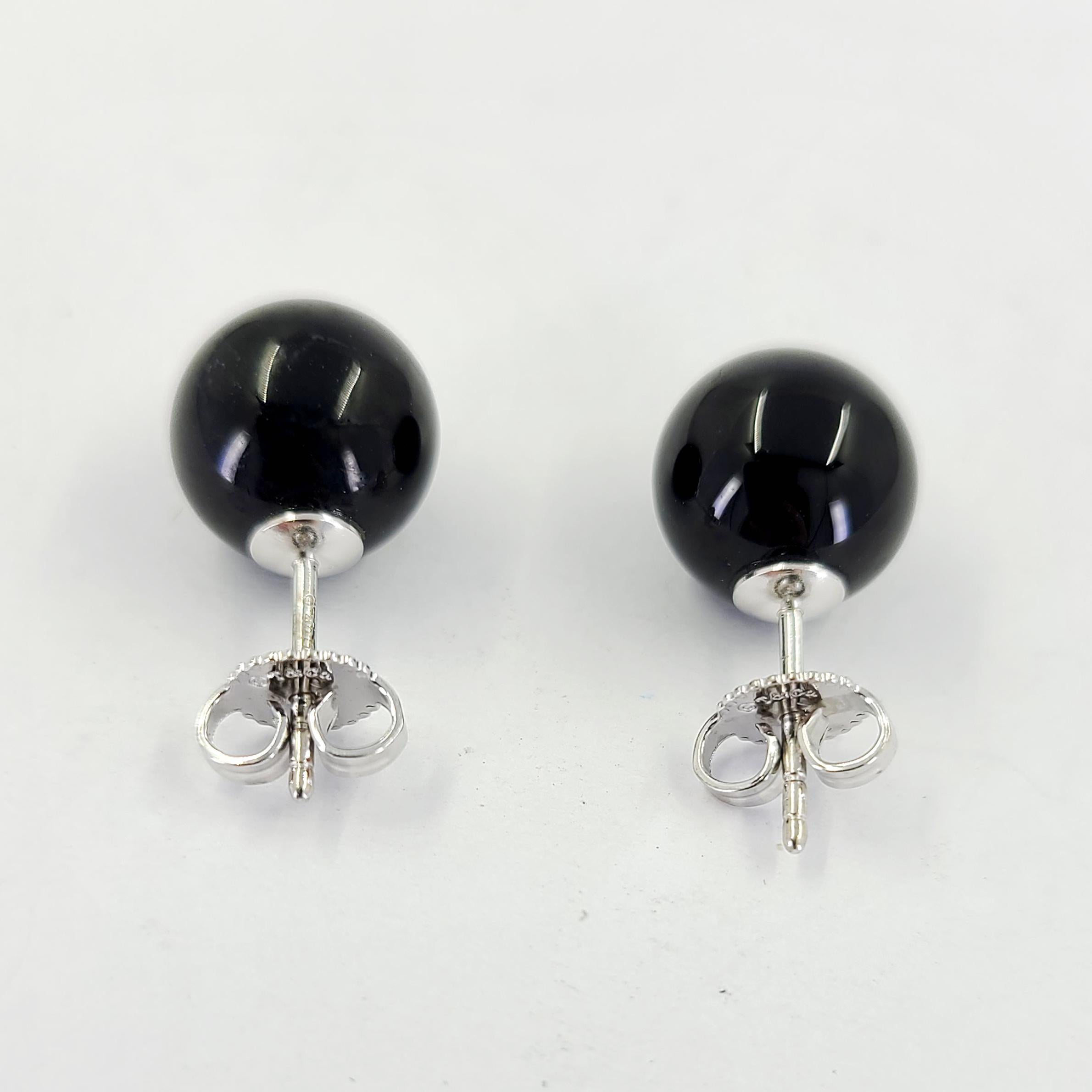 Estate Tiffany & Co. 18 Karat White Gold 10mm Round Onyx Stud Earrings. Pierced Post With Friction Back. MSRP $385