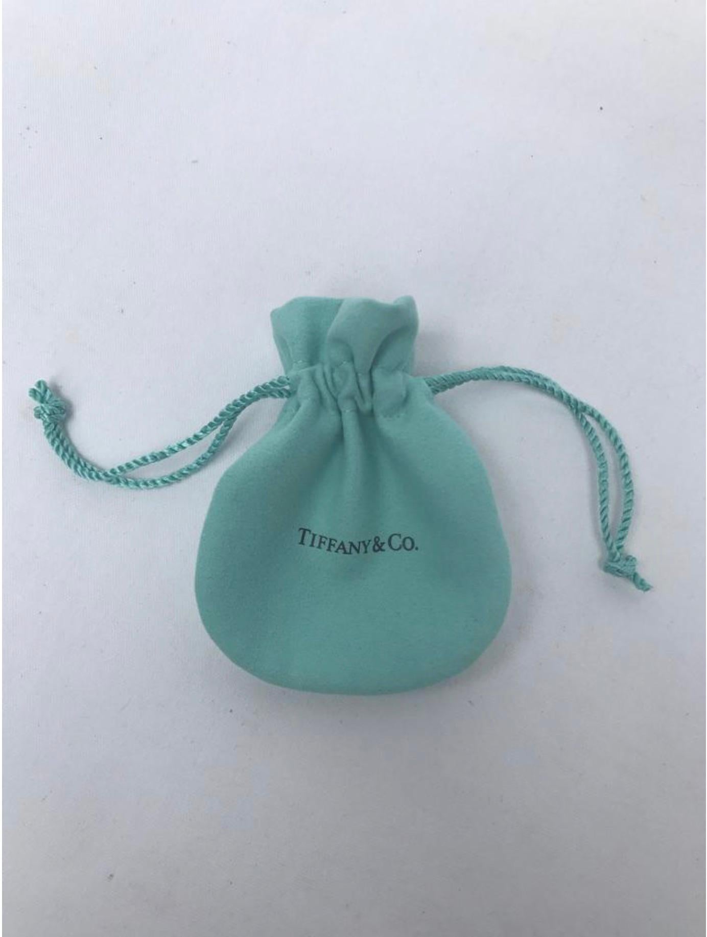 Model -Tiffany and Co. White Lollipop Charm

Condition - Very good!

SKU - 915.1

Original Retail - $200 + tax

Dimensions - .7 x .5 x .1

Material - Sterling Silver .925

Comes with - Dust Bag