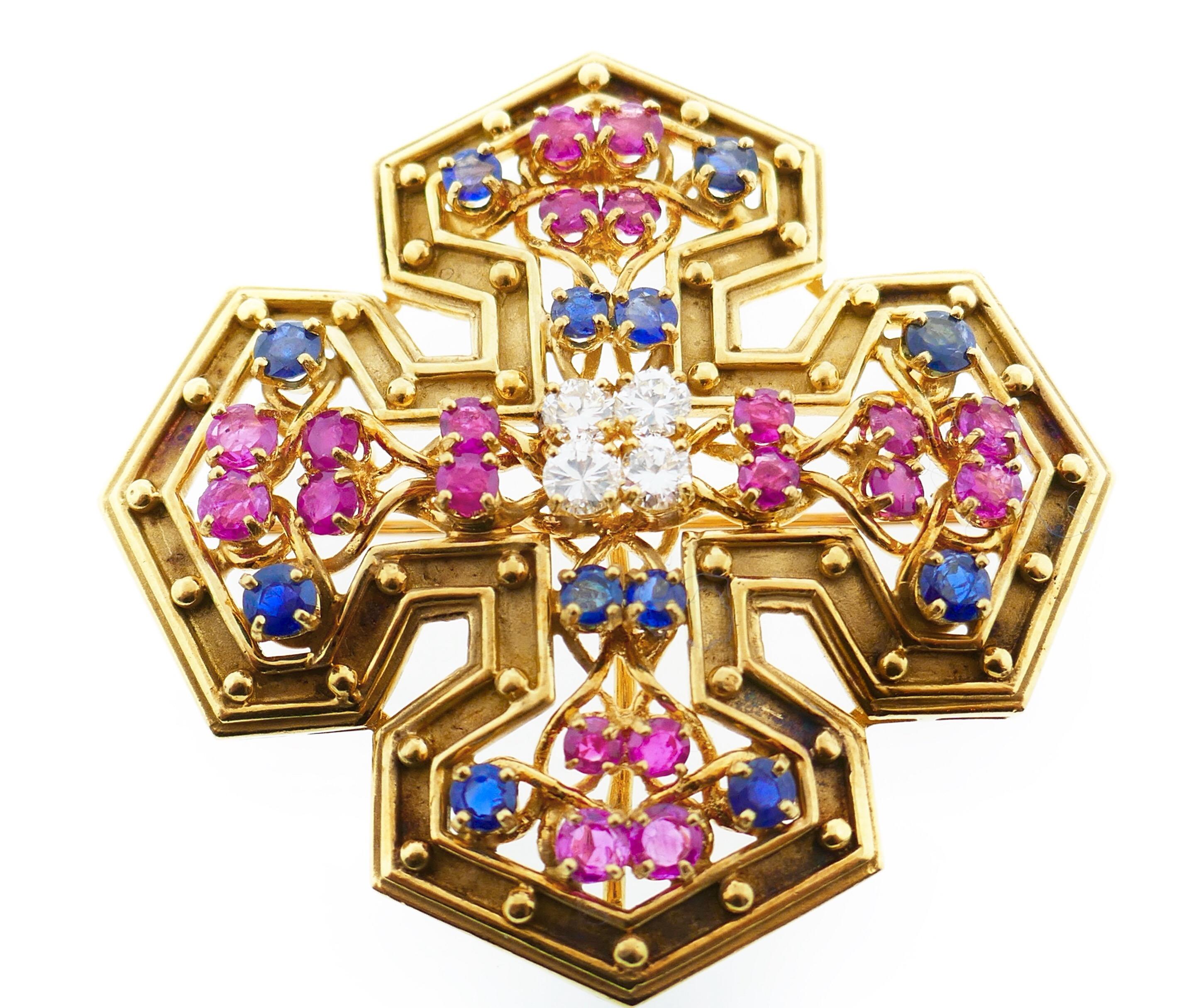 Tiffany & Co. White Pink Blue Sapphire 18 Karat Yellow GoldMaltese Cross Brooch / Pendant

A very unique piece. It can be worn as a brooch or a pendent. This maltese cross is set with three different types of excellent quality sapphires: pink, blue,