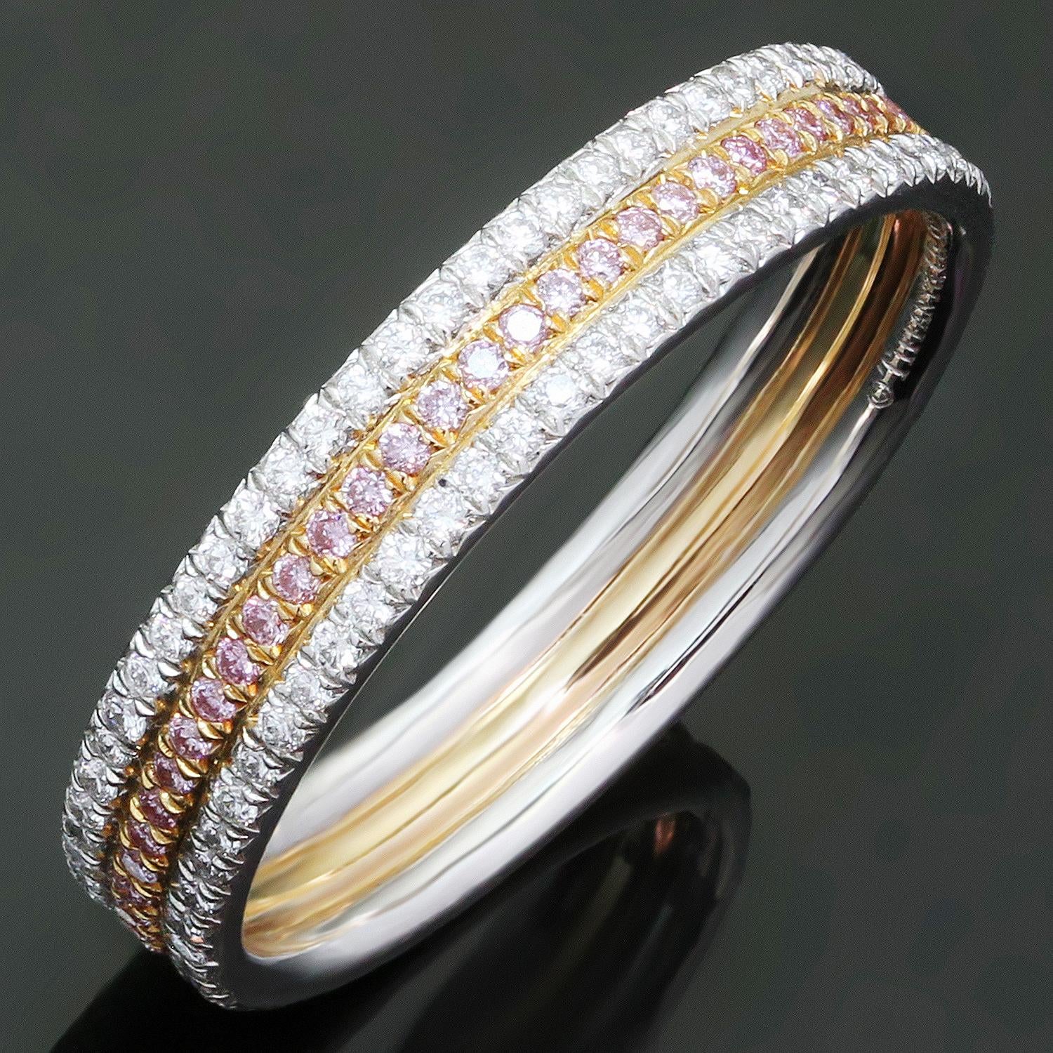 This stunning three-row band from Tiffany & Co. features white & pink F-G VVS2-VS1 brilliant-cut round diamonds of an estimated 0.55 carats, with pink diamonds set in 18k rose gold and white diamonds set in 950 paltinum. Made in United States circa