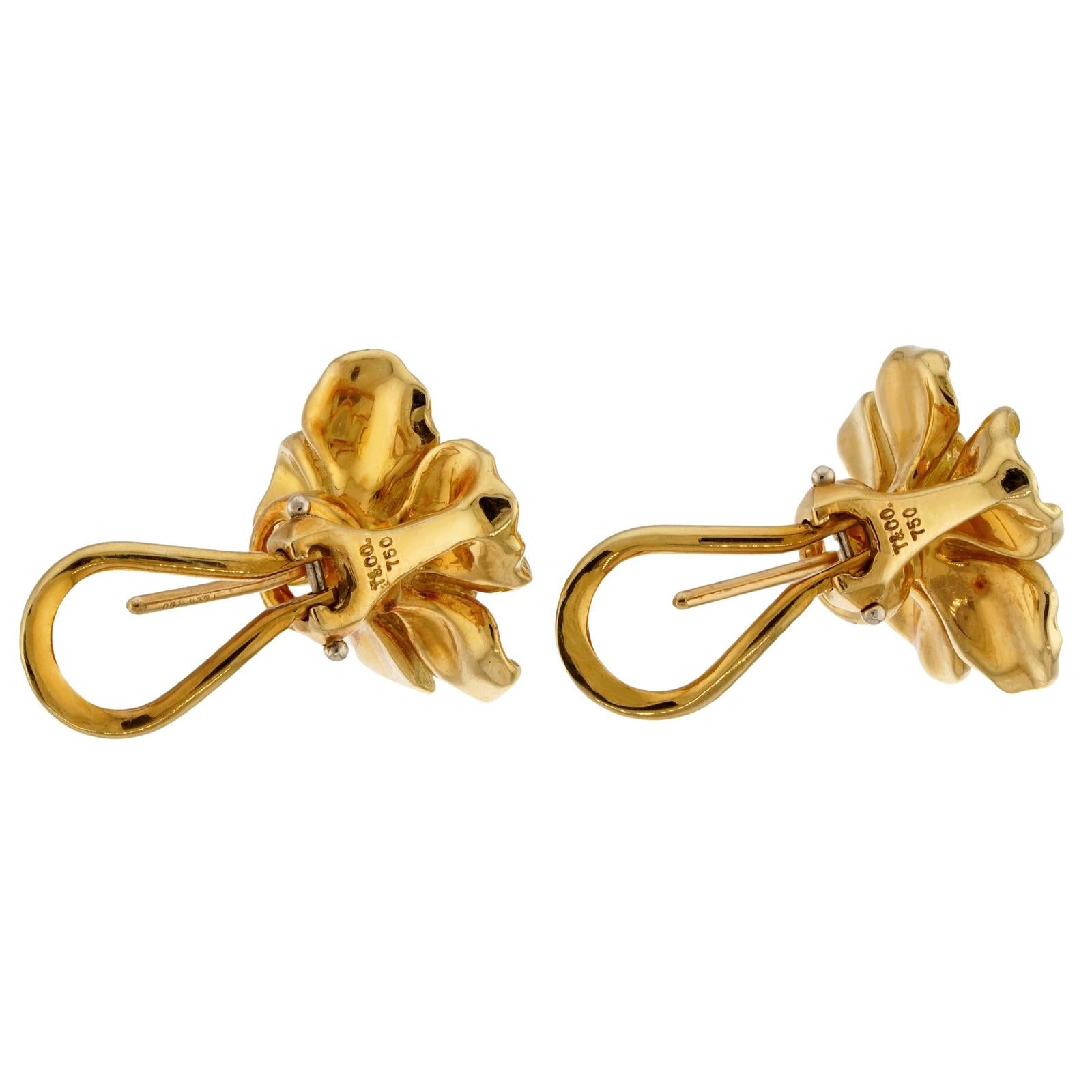 These gorgeous Tiffany clip-on earrings from the elegant floral Dogwood collection feature a wild rose flower design crafted in 18k yellow gold. Made in United States circa 1980s. Measurements: 0.62