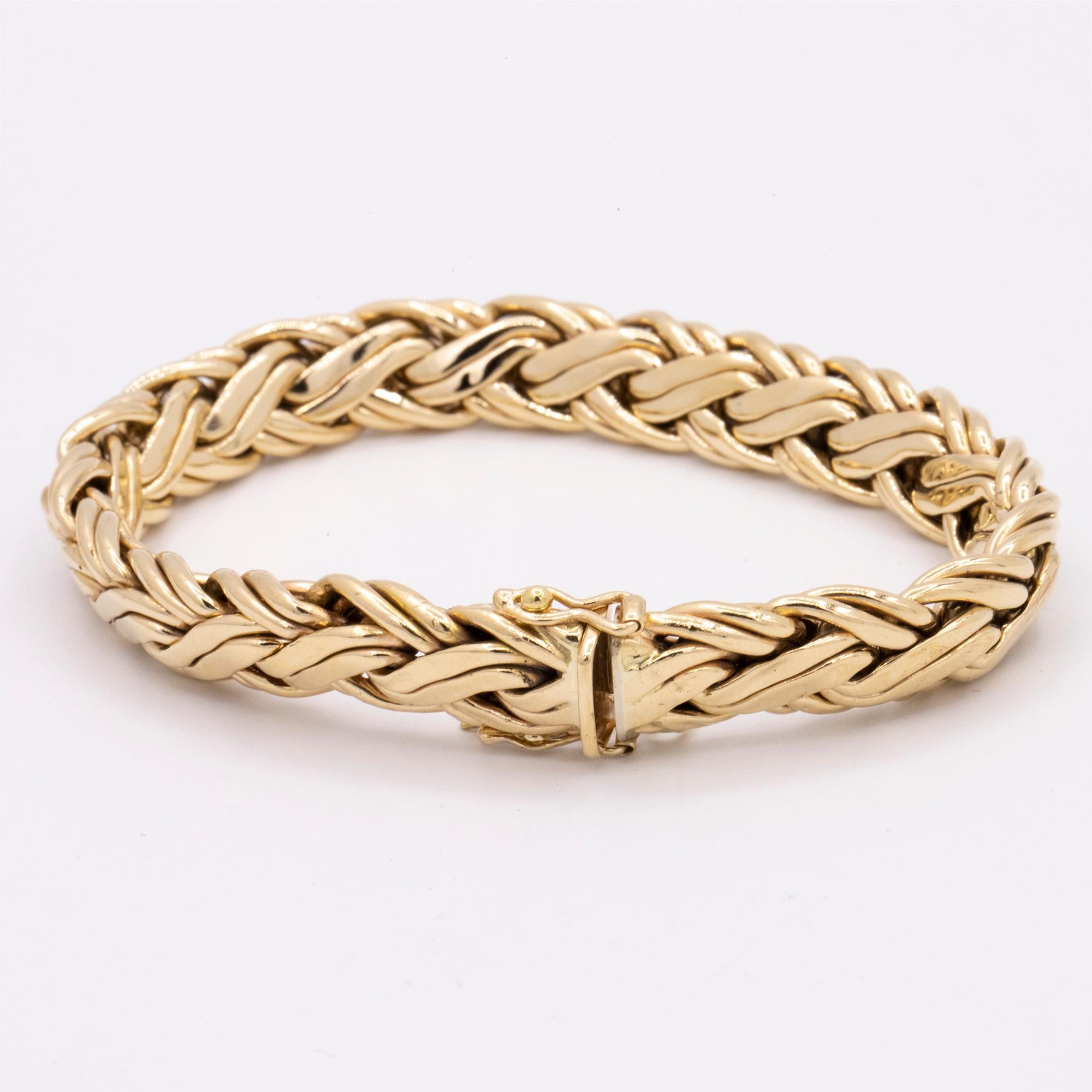 Curated from the master jewelers Tiffany & Co. This vintage woven  bracelet is in mint condition. It is stamped 585 (14kt) and Tffany & Co. It has a total weight of 17.23dwt.

It has been expertly restored by our master jewelers.