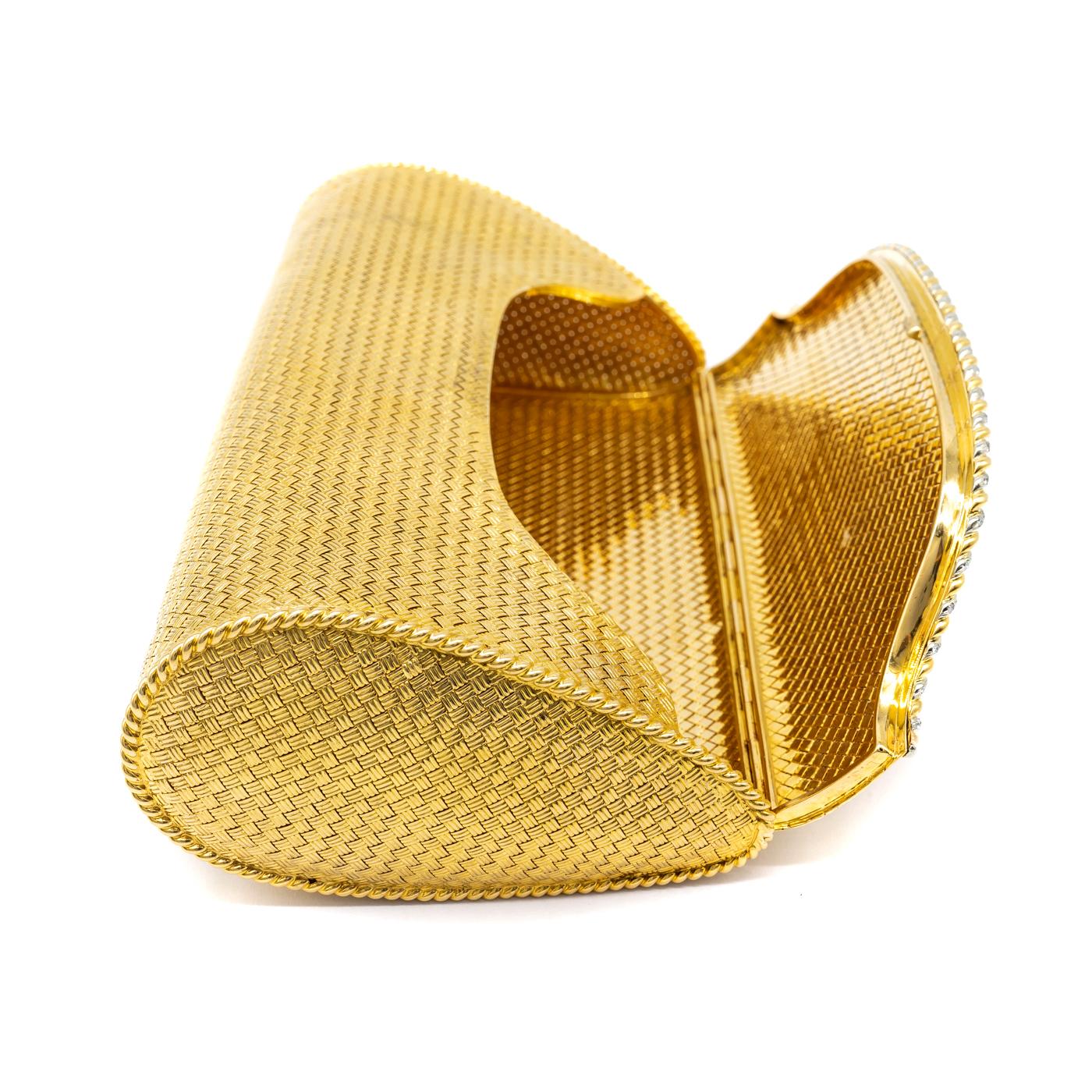 A vintage, Tiffany & Co., 18ct woven gold evening bag, with round brilliant-cut diamonds, set in a braid style twist, along the opening, signed Tiffany & Co., circa 1950.