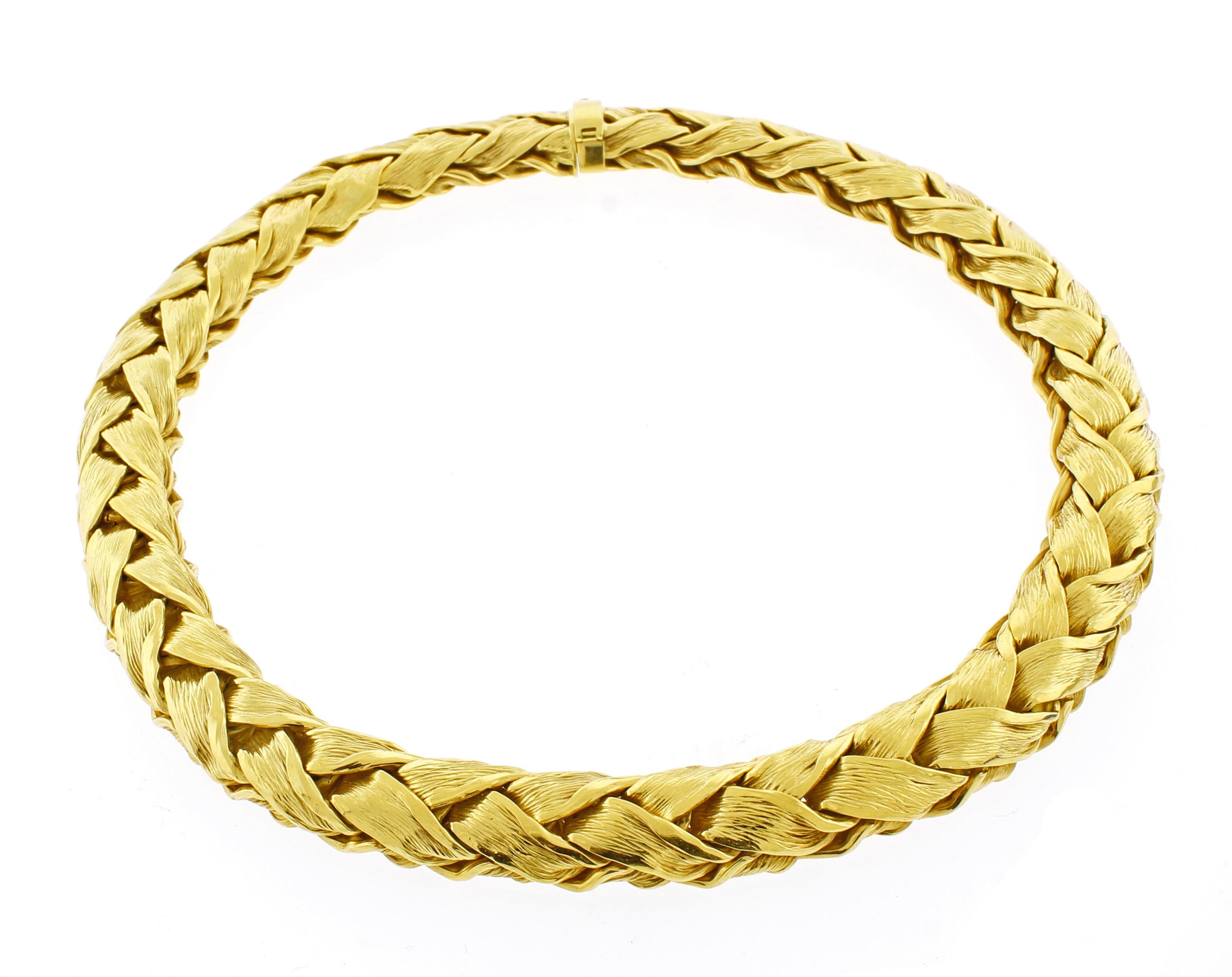 From Tiffany & Co. this wide  woven  choker necklace. This bold necklace boasts over five ounces of shimmering 18 karat gold
♦ Designer: Tiffany & Co.
♦ Metal: 18 karat
♦ 9/16 of an inch wide 
♦ 16 inch
♦ Circa 1985
♦ 167 grams
♦ Packaging: