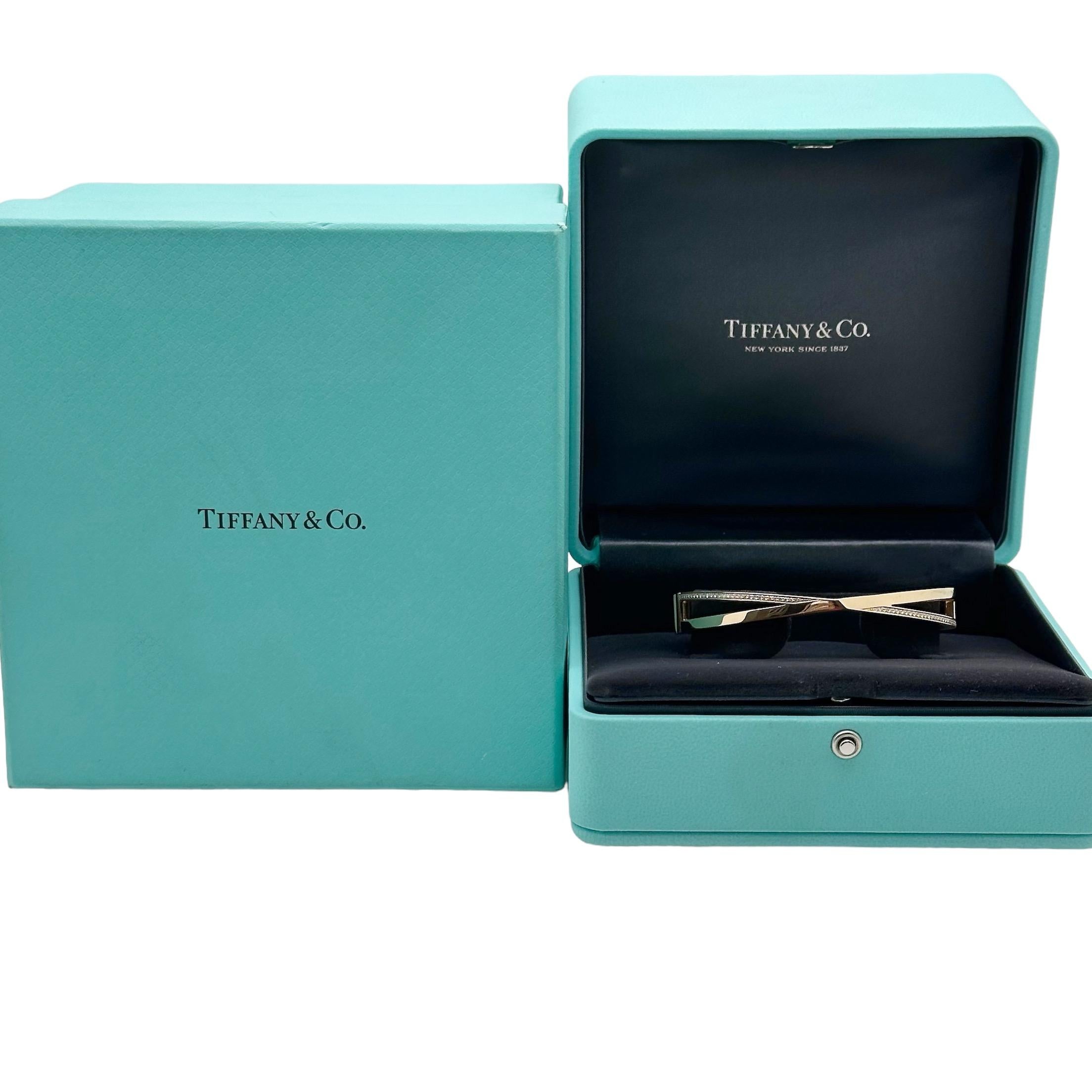 Tiffany & Co. X Narrow Hinged Bangle with Diamonds
Style:  Bangle
Ref. number:  67809491
Metal:  18kt Rose Gold
Size / Measurements:  3 mm - 9 mm ( fits up to 6.25' wrist )
Main Diamond:  50 Round Brilliant Diamonds 0.21 tcw
Hallmark:  ©TIFFANY&CO.