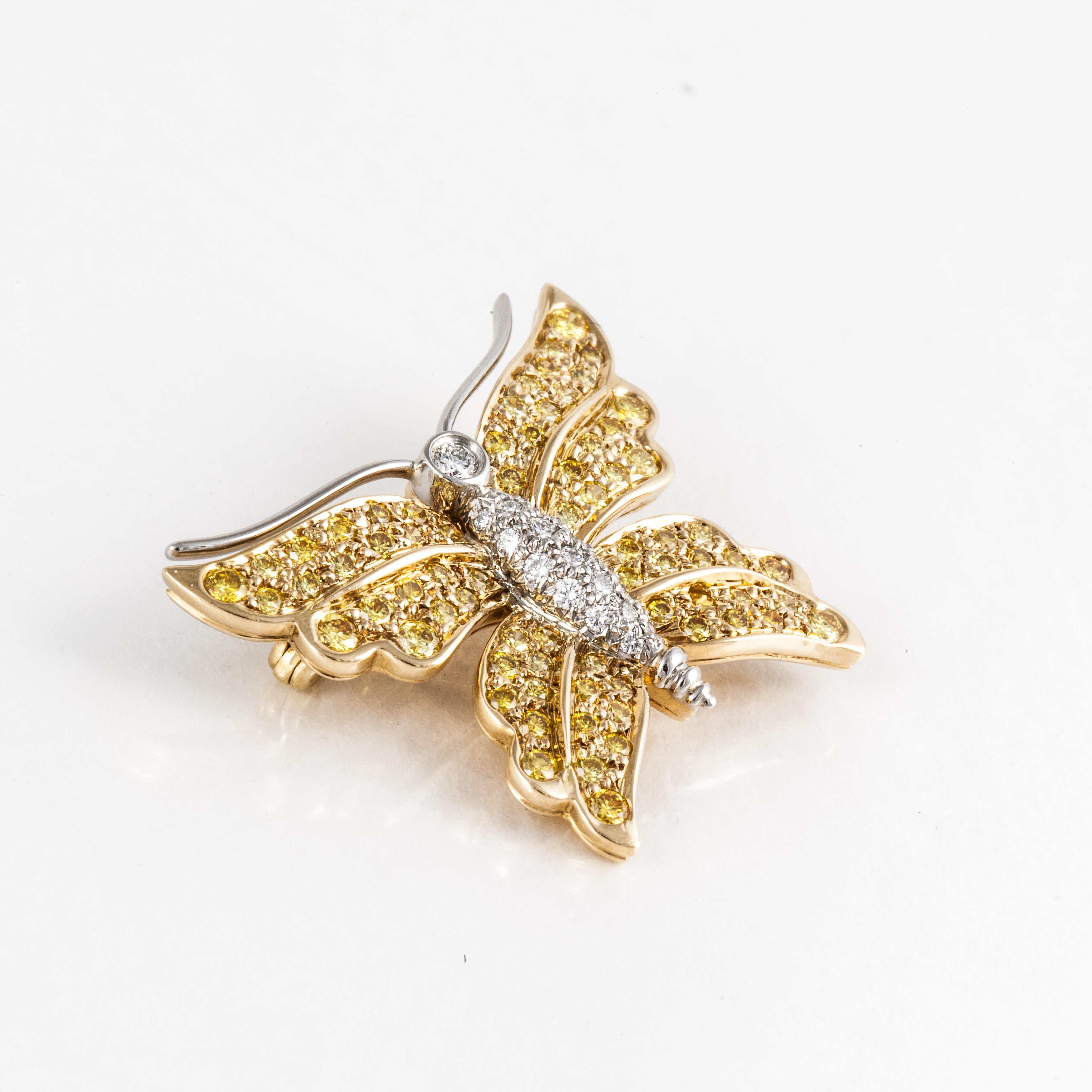 Tiffany & Co. butterfly pin in 18K yellow gold and platinum with white and yellow diamonds.  It features seventy-two round fancy yellow diamonds that total 1.25 carats, VS1-SI clarity.  In addition, there are eighteen round brilliant-cut diamonds