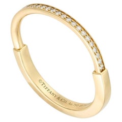 Anello con chiusura Tiffany & Co. in oro giallo e diamanti, misura 62