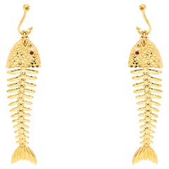 Tiffany & Co. Orecchini a lisca di pesce in oro giallo e rubino