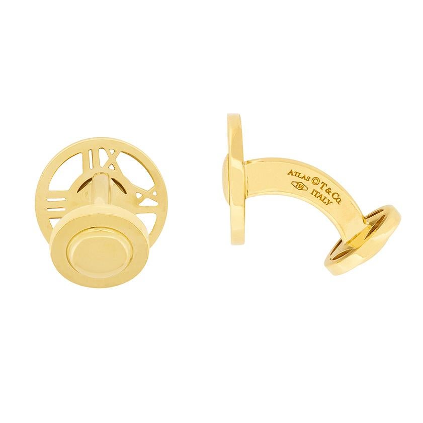 These Tiffany & Co cufflinks are from their Atlas collection and made in solid 18 carat yellow gold. The roman numeral design is indicative of the collection and the cufflinks date to around 1990. They weigh 15.2 grams and have the original T & Co