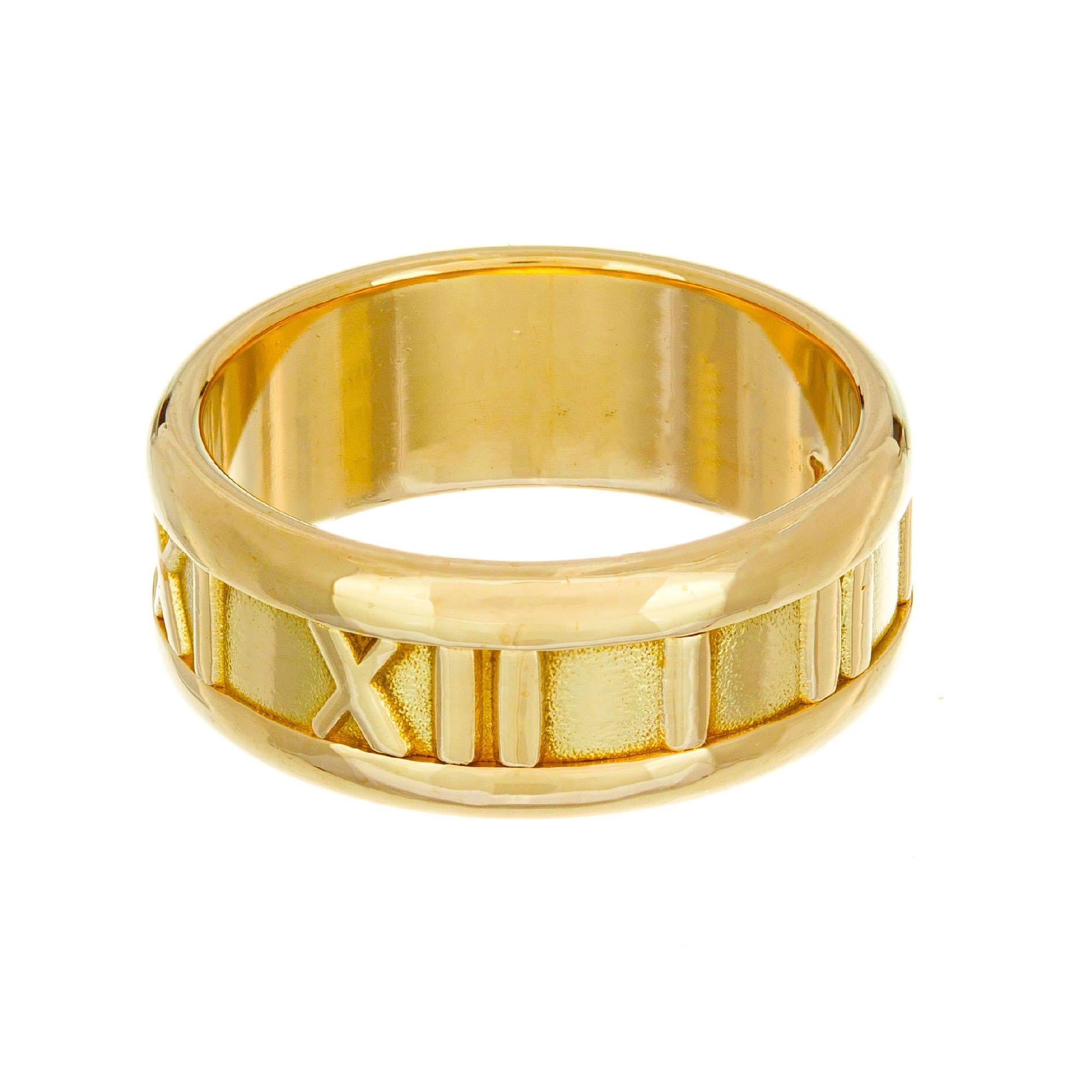 Tiffany & Co 7mm Atlas 18k yellow gold wedding band

Size 6- not easily sizable 
18k yellow gold 
Stamped: 750
Hallmark: Tiffany & Co
8 grams
Width at top: 6.9mm
Height at top: 1.7mm
Width at bottom: 6.9mm



