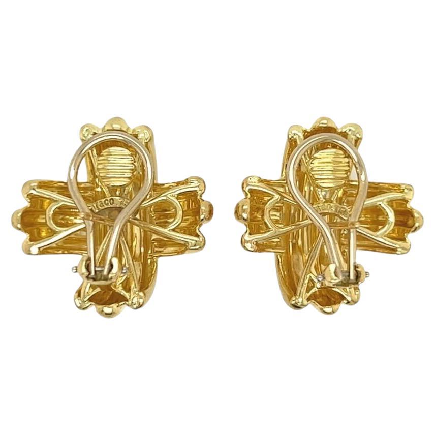A pair of 18 karat yellow gold earrings, Tiffany & Co.  Each “ Signature X” earring fashioned as bombe X with fluted design.  Length approximately 7/8 inch.  Gross weight approximately 22.70 grams.  Signed T & Co.