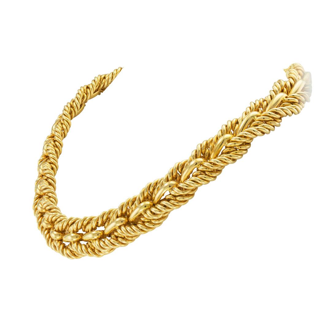 Tiffany & Co woven gold link collar style necklace circa 1980. *

ABOUT THIS ITEM:  #B-DJ512E. Scroll down for detailed specifications.  This Tiffany & Co woven gold link collar style necklace is a piece of jewelry that exudes elegance and