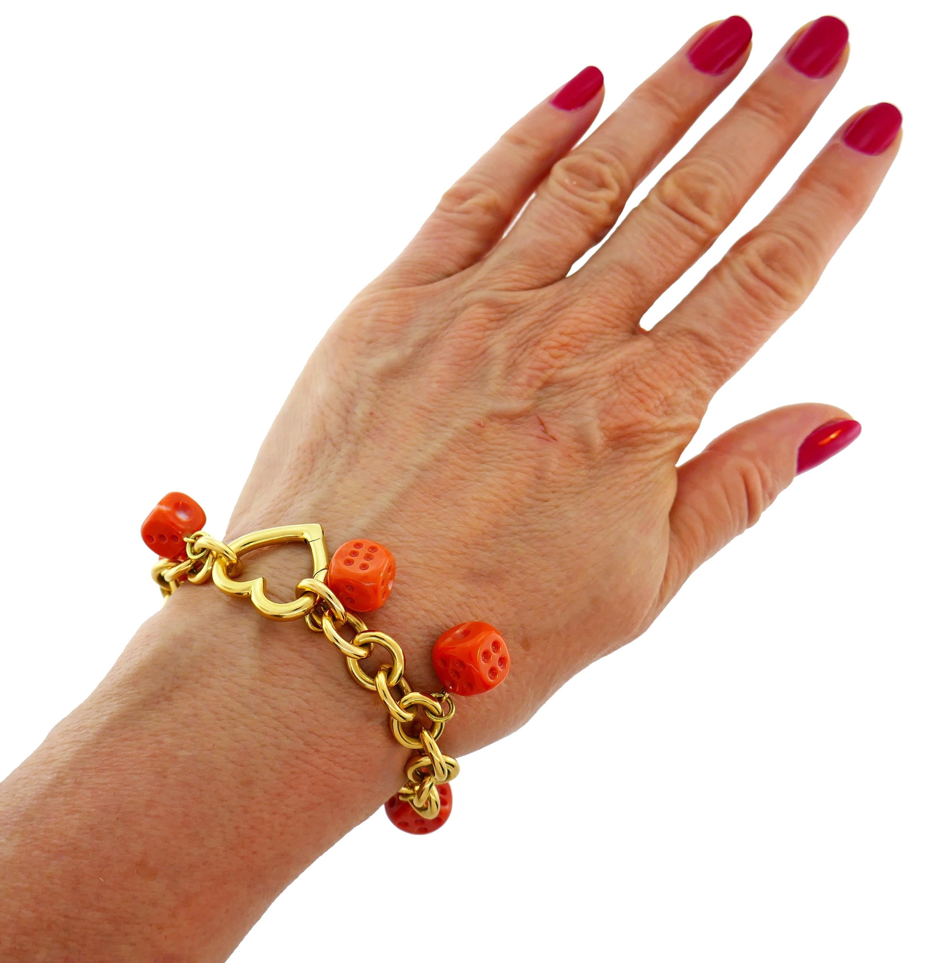 Lovely Tiffany & Co. bracelet with Mediterranean coral dice charms. Wearable and fun, the bracelet is a great addition to your jewelry collection. It brings good luck in a casino ;-)
The bracelet is made of 18 karat yellow gold. 
The bracelet
