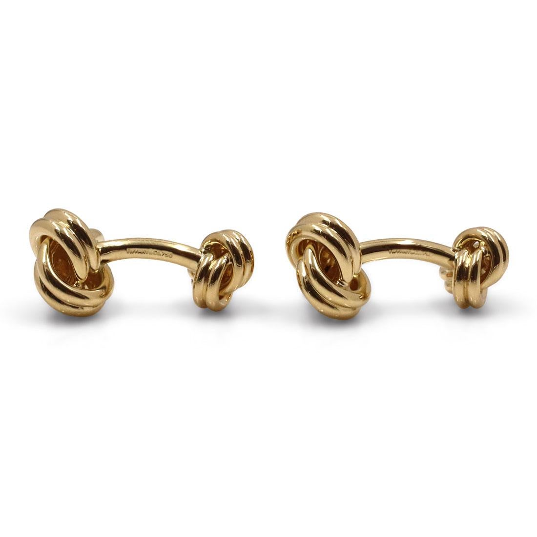 Authentic Tiffany & Co. Knot cufflinks crafted in 18 karat yellow gold. These classic cufflinks are designed in the shape of a knot on both ends. Signed Tiffany & Co., 750. The cufflinks are not presented with the box or papers. CIRCA 2010s

Brand: