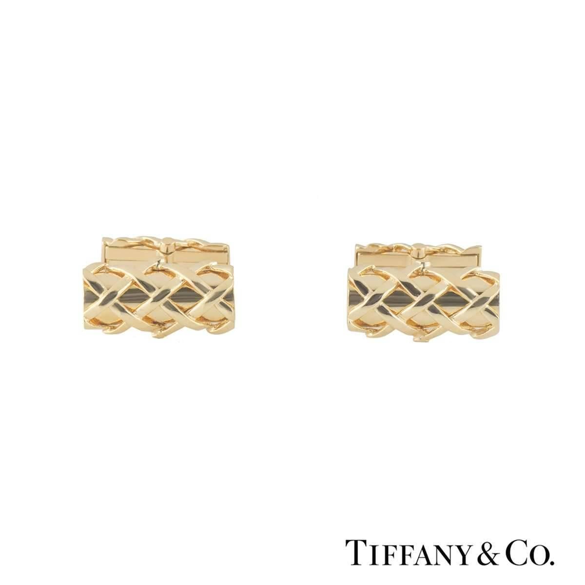 A smart pair of 18k yellow gold Tiffany & Co. cufflinks. The cufflinks comprise of a rectangular motif with a 3D basket design featuring a T-bar fitting. The cufflinks measure 18mm in width and 9mm in height with a gross weight of 21.10 grams. 

The