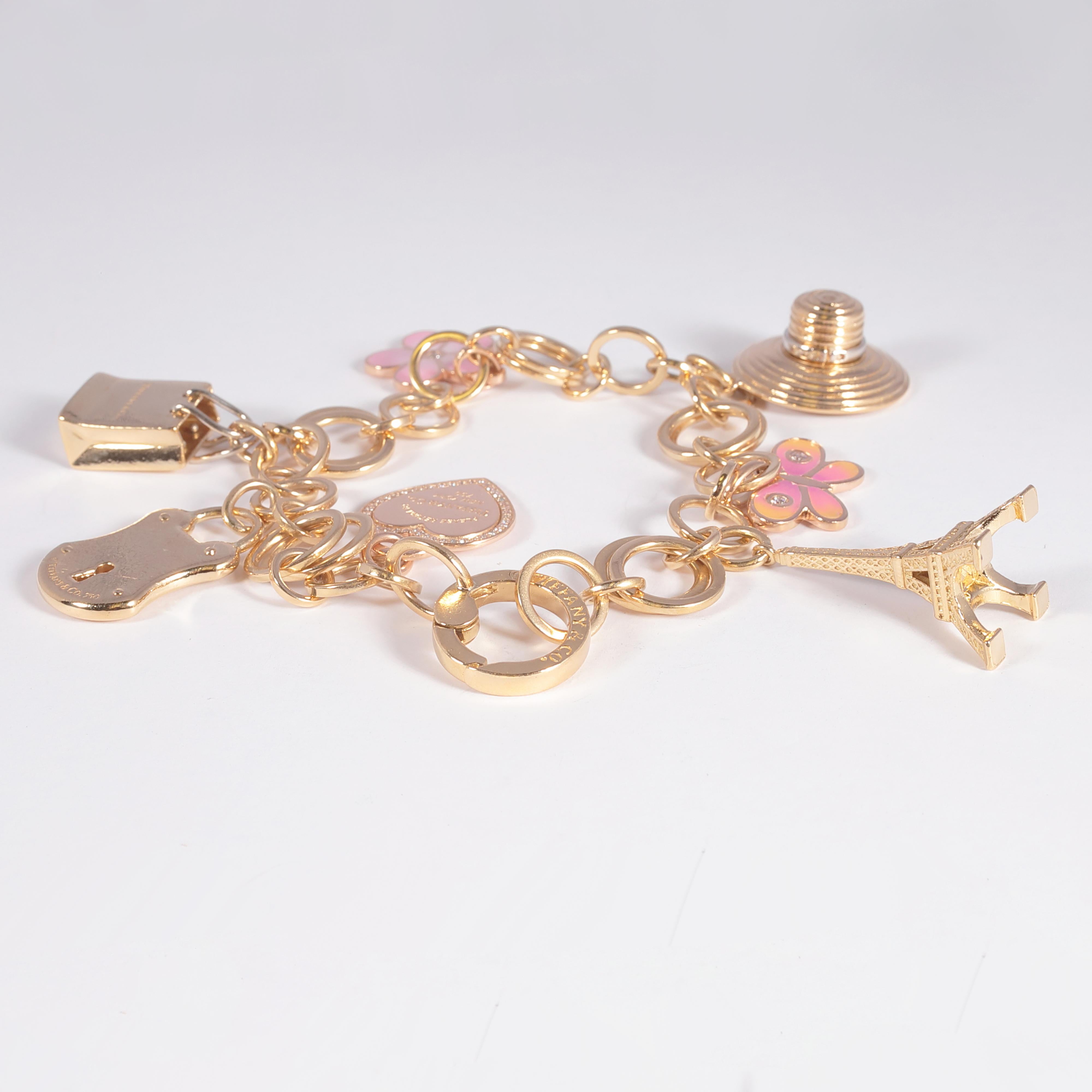 Tiffany & Co. Yellow Gold Diamond Enamel Charm Bracelet In Good Condition In Dallas, TX