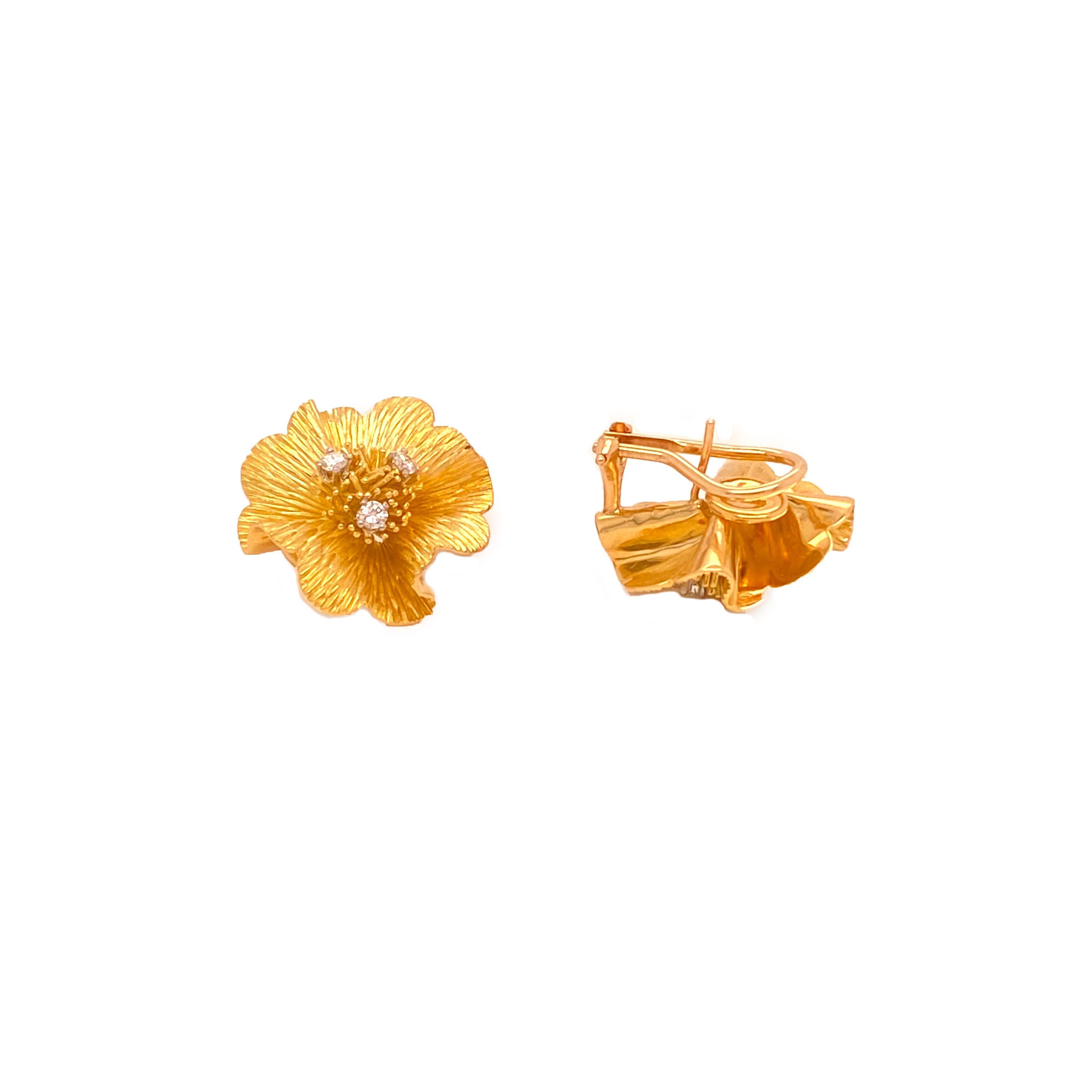 Offered here is a pre owned Tiffany & Co flower earring, centering a cluster adorned with 3 natural earth mined round top quality diamonds in each flower. 
A total of 6 diamonds weighing 0.30 carat total averaging E-F in color and VS in clarity.