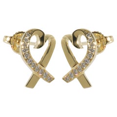 Tiffany
Co. Boucles d
oreilles en or jaune avec diamants Paloma Picasso Loving Heart