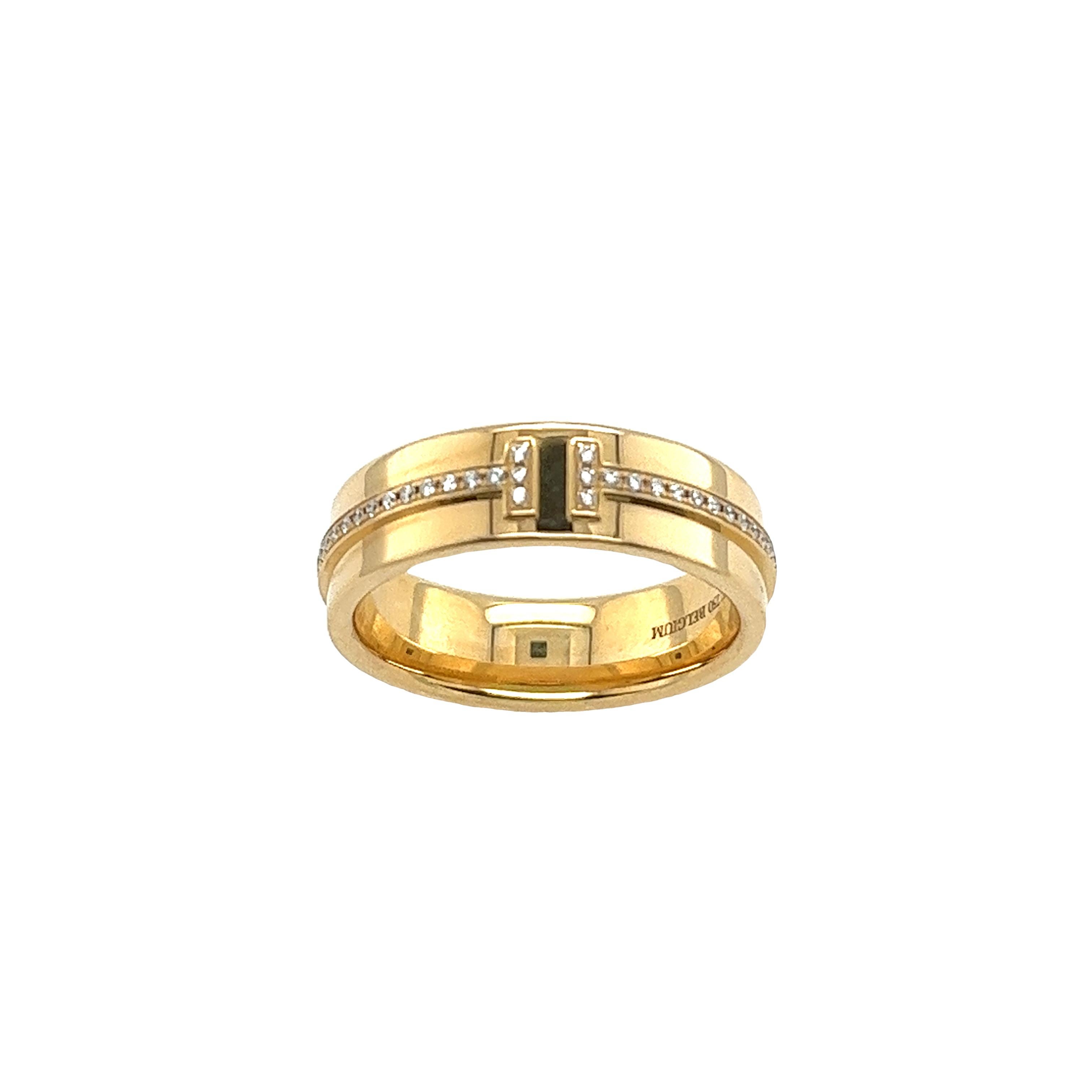 Experience refined luxury with the Tiffany & Co. Yellow Gold Diamond T Narrow Ring. Crafted with exquisite attention to detail, this elegant piece combines the warmth of yellow gold with the brilliance of diamonds. With its sleek design and subtle