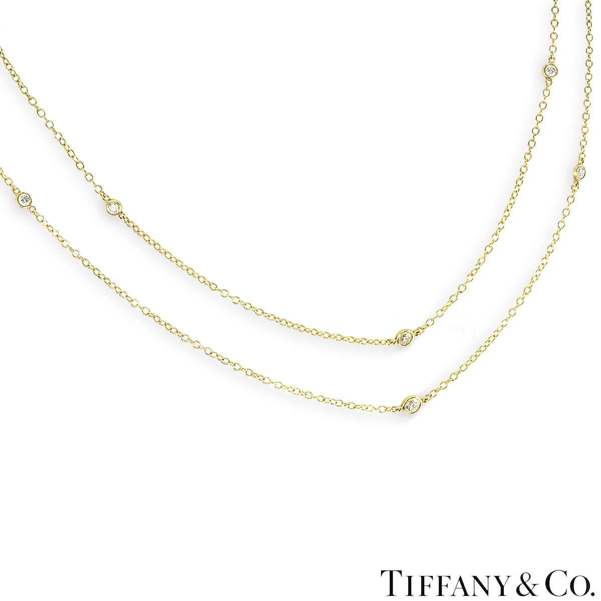 A beautiful yellow gold diamond necklace by Tiffany & Co. from their Elsa Peretti Diamonds By The Yard collection. The necklace features 12 round brilliant cut diamonds weighing approximately 1.21ct in total. Measuring 36 inches, the necklace