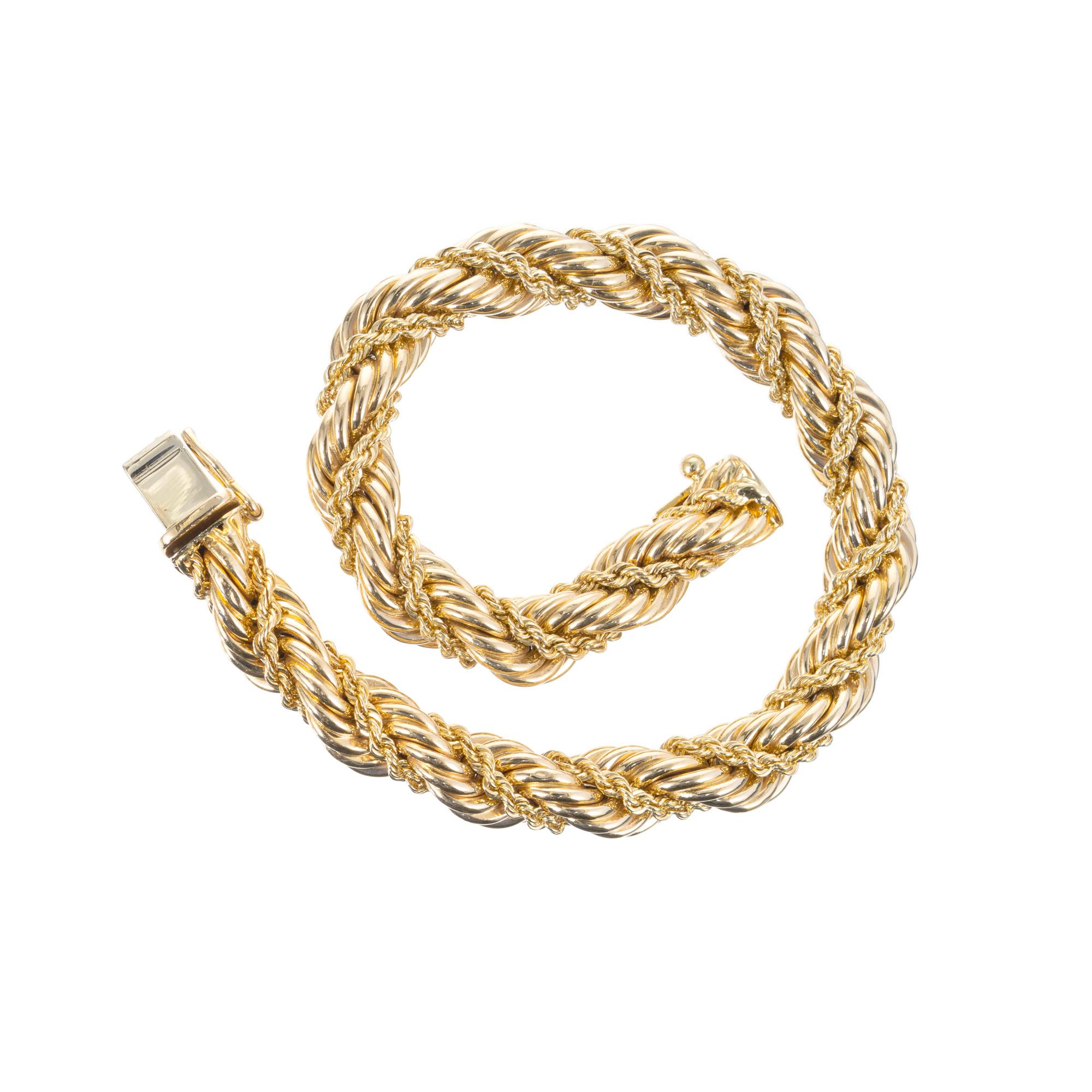 1960's original Tiffany & Co rope bracelet. 14k yellow gold twisted wire bracelet. There is also a second rope strand braided in the center. 7.5 inches. This classic Tiffany mid-century bracelet is stamped with Tiffany + Co hallmark. 

14k yellow