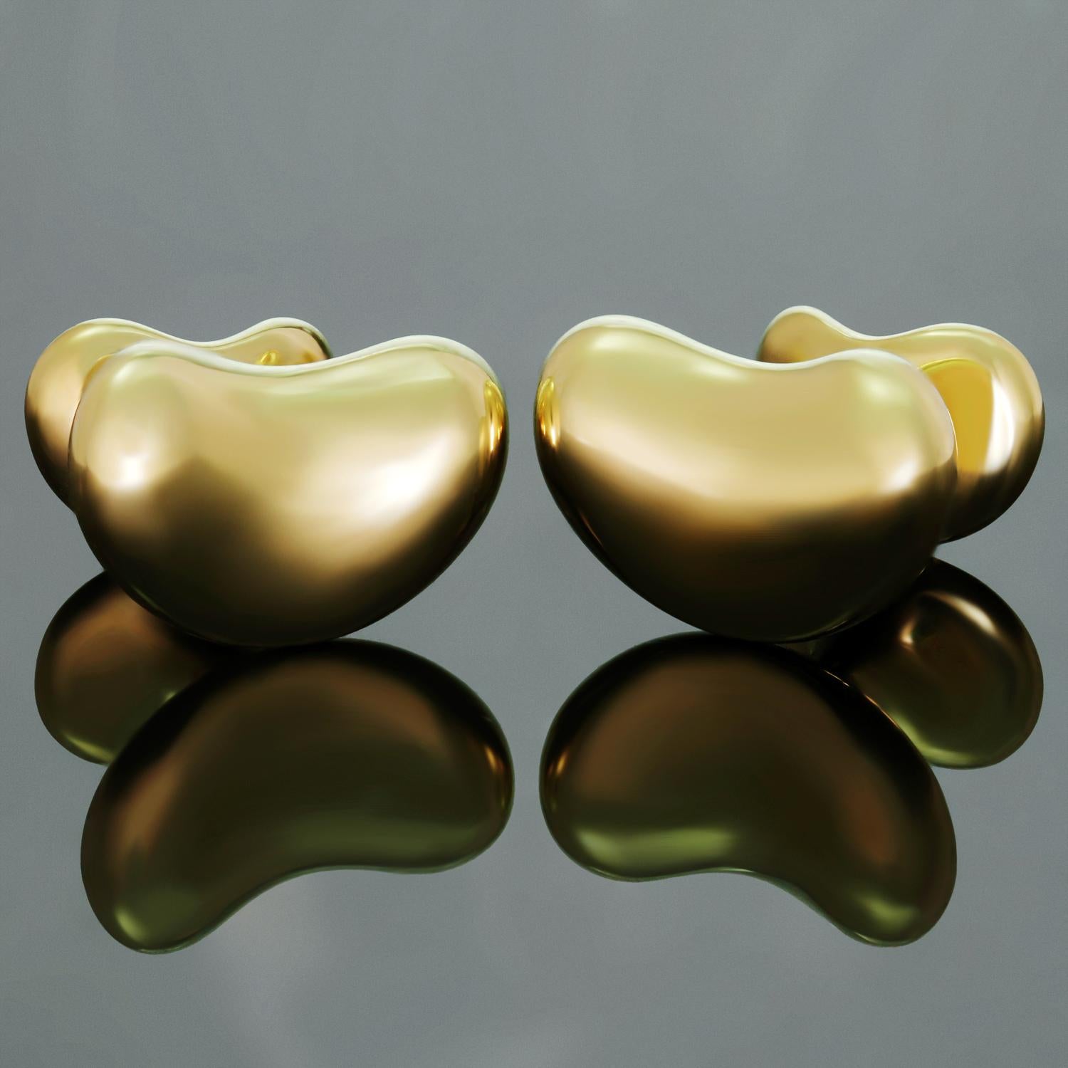These iconic cufflinks by Tiffany & Co. feature Elsa Peretti's classic bean design crafted in 18k yellow gold. Made in Spain circa 2010s. Measurements: 0.70