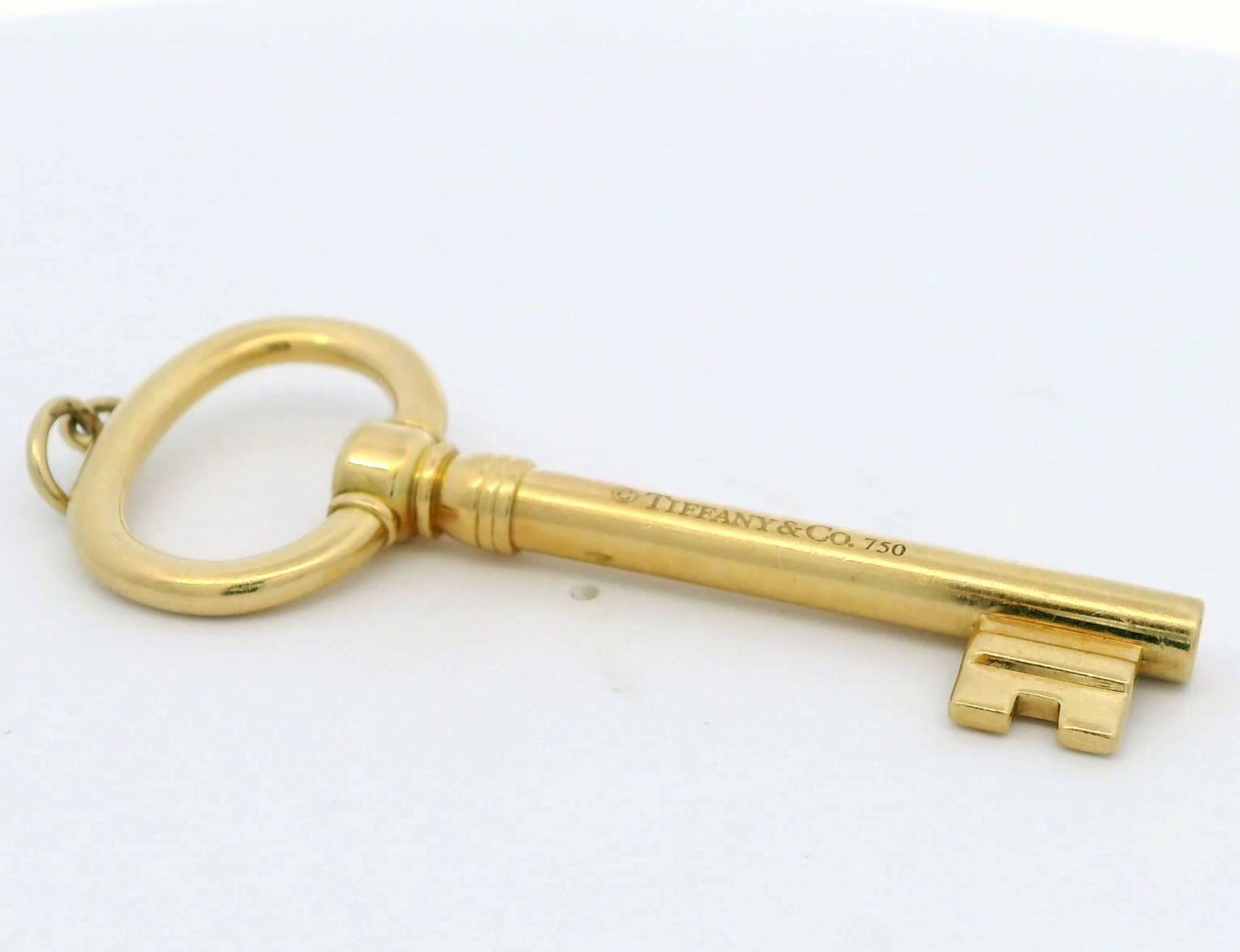 Women's or Men's Tiffany & Co. yellow gold key pendant For Sale