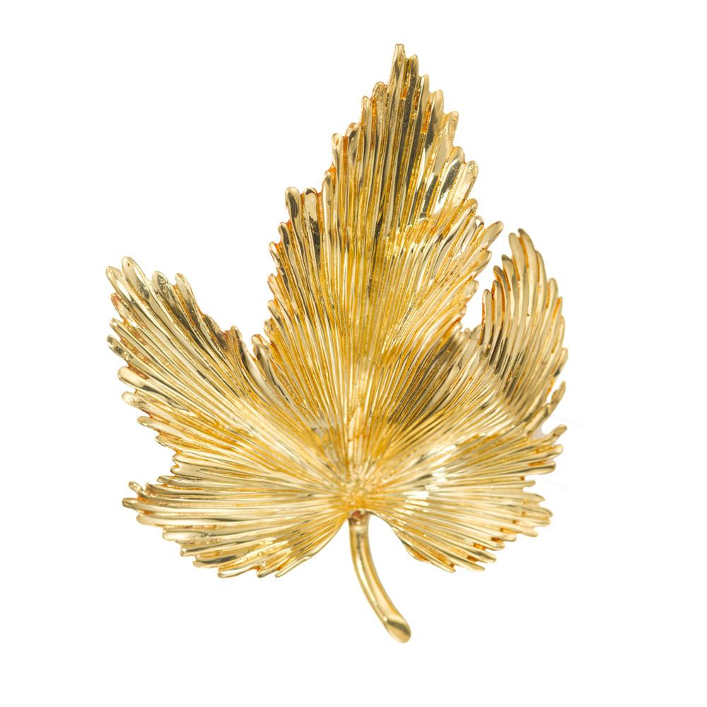 1970's Textured 18k yellow gold Tiffany & Co Leaf brooch.  

18k yellow gold 
Stamped: 18k Italy
Hallmark: Tiffany + Co
9.7 grams
Top to bottom: 45.84mm or 1.80 Inches
Width: 35.5mm or 1.39 Inches
Depth or thickness: 8.6mm
