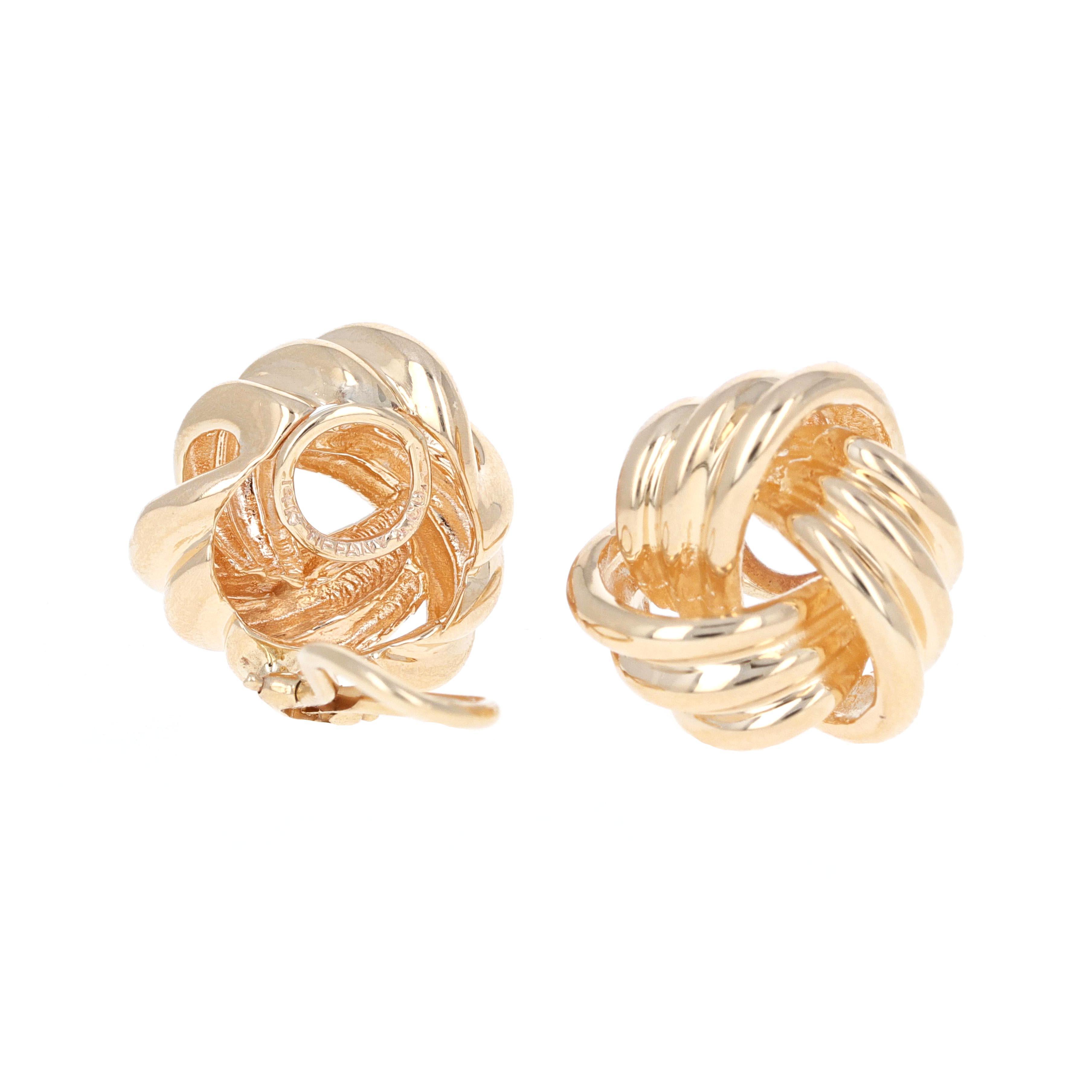 Authentic Tiffany & Co. yellow gold clip-on love knot earrings. These earrings are made in 14 karat yellow gold. They do not have a post and are clip-on with a lever-back.  They are in excellent condition and have the Tiffany & Co. Hallmark on the