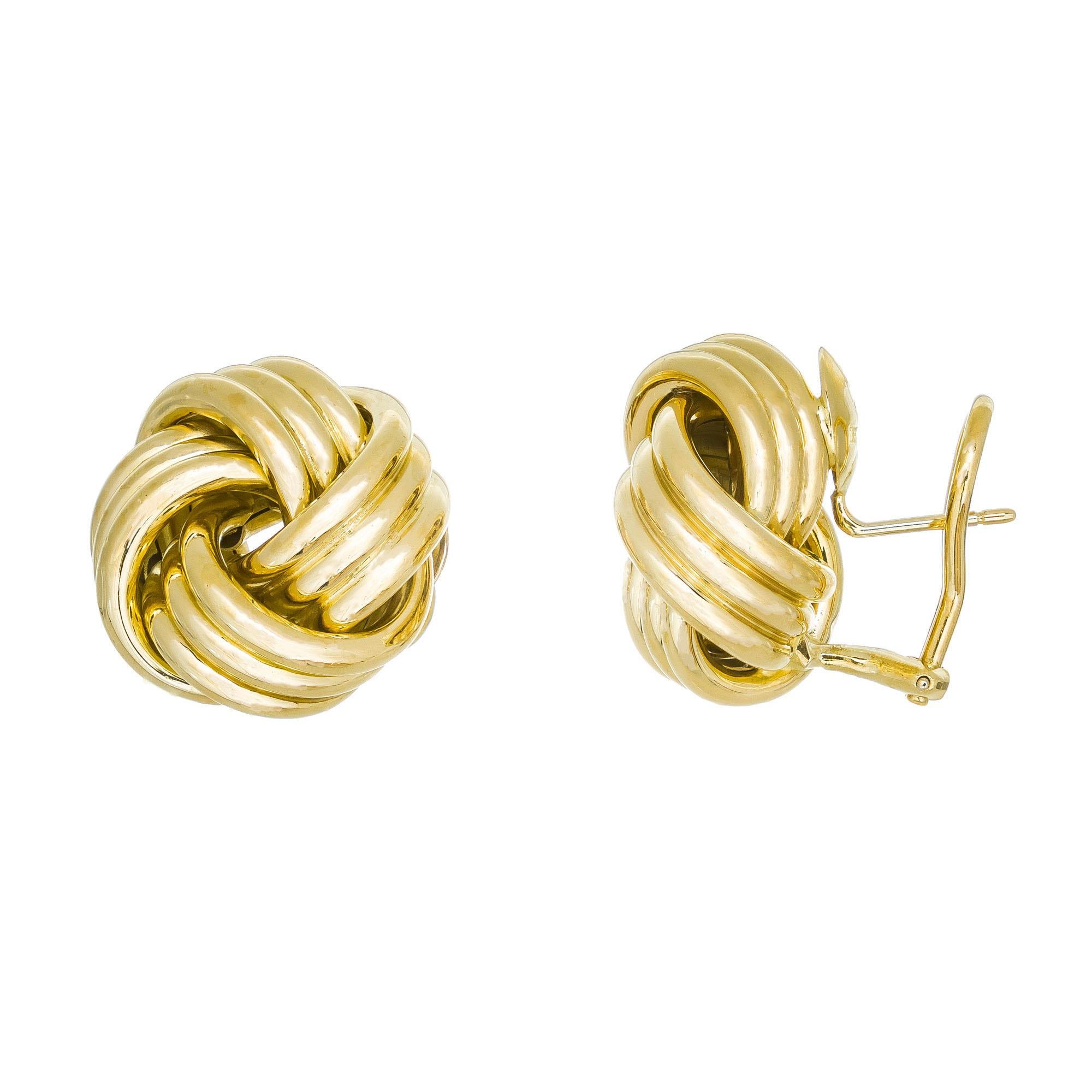 Tiffany & Co 3-dimensional love knot earrings in 18k yellow gold with posts and omega clips 

18k yellow gold 
Stamped: 750
Hallmark: Tiffany & Co
14.5 grams
Top to bottom: 20.3mm or 13/16 Inches
Width: 20.4mm or 13/16 Inches
Depth or thickness: