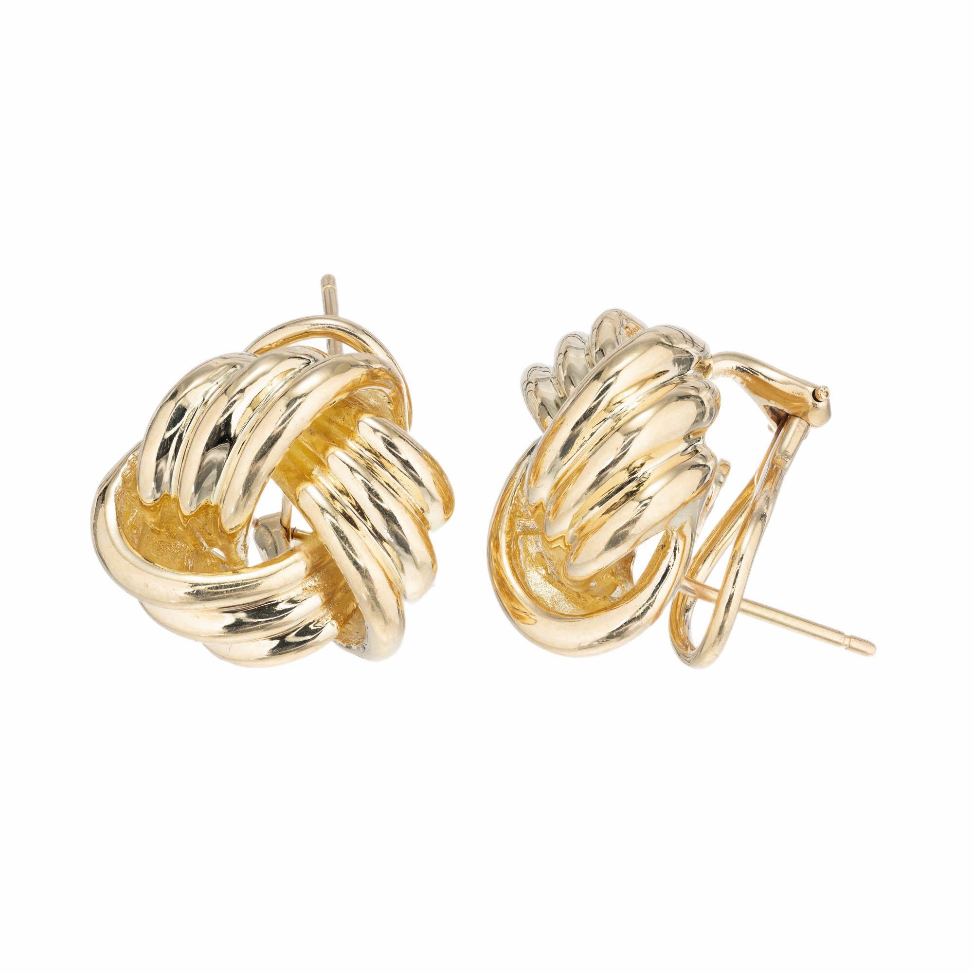 Classic Tiffany & Co clip post 18k yellow gold love knot earrings. Posts and earrings both stamped Tiffany 750

18k yellow gold 
Stamped: 18k 750
Hallmark: Tiffany + Co
14.8 grams
Top to bottom: 18.1mm or 11/16 Inch
Width: 17.3mm or 11/16 Inch
Depth