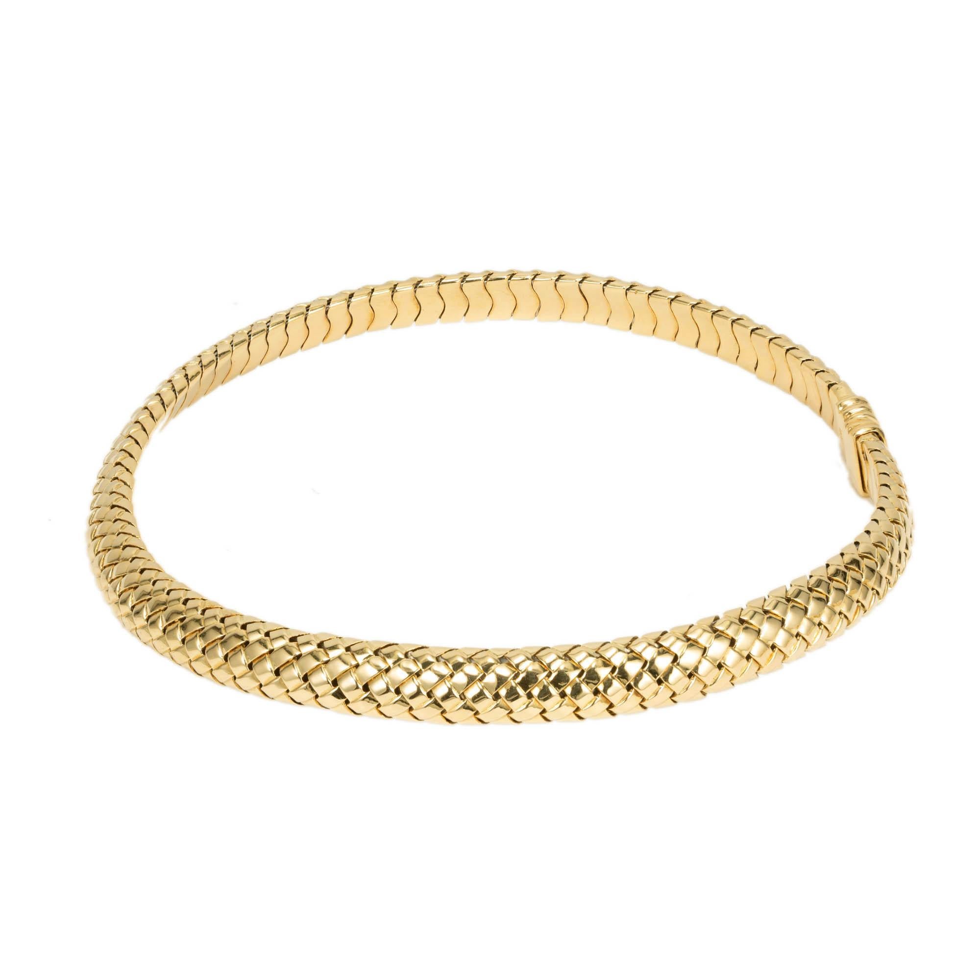 Tiffany & Co mesh 18k gold woven neck choker. 1977 authentic Tiffany & Co. Spring open at the end to fit a 16 inch neck.

18k yellow gold
Tested: 18k
Stamped: 750
Hallmark: 1977 Tiffany & Co
79.5 grams
Top to bottom: 10mm or .40 inch
Depth: 4.5mm