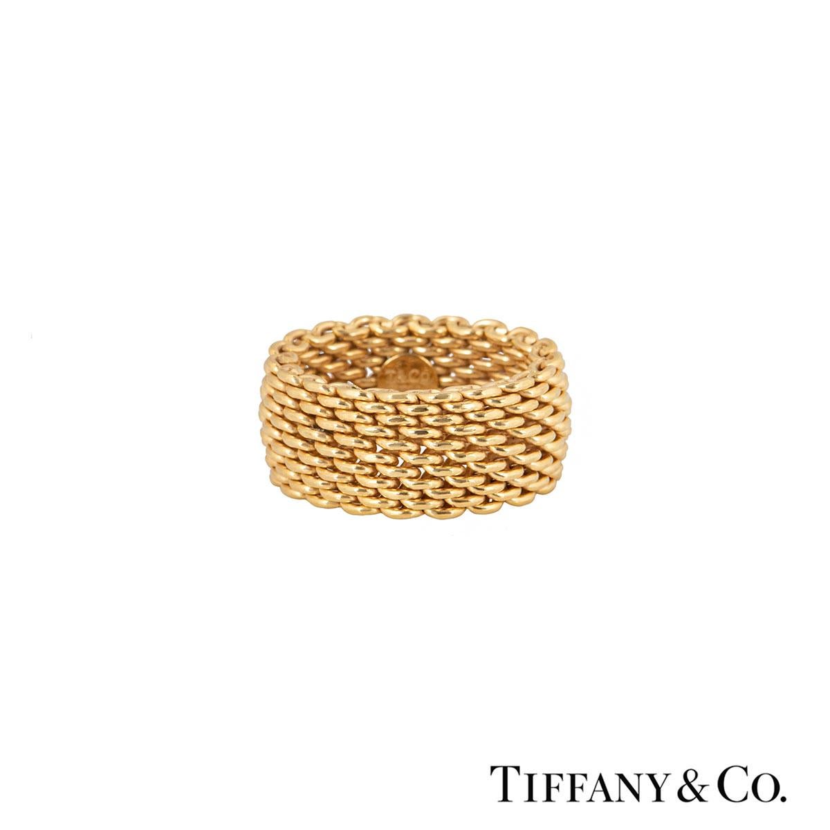 A unique 18k yellow gold Tiffany & Co. ring from the Somerset collection. The ring is made up 6 rows of intertwined woven links. The ring measures 10mm in width and is flexible. The ring is a size UK N½, US 6 3/4, and has a gross weight of 12.70