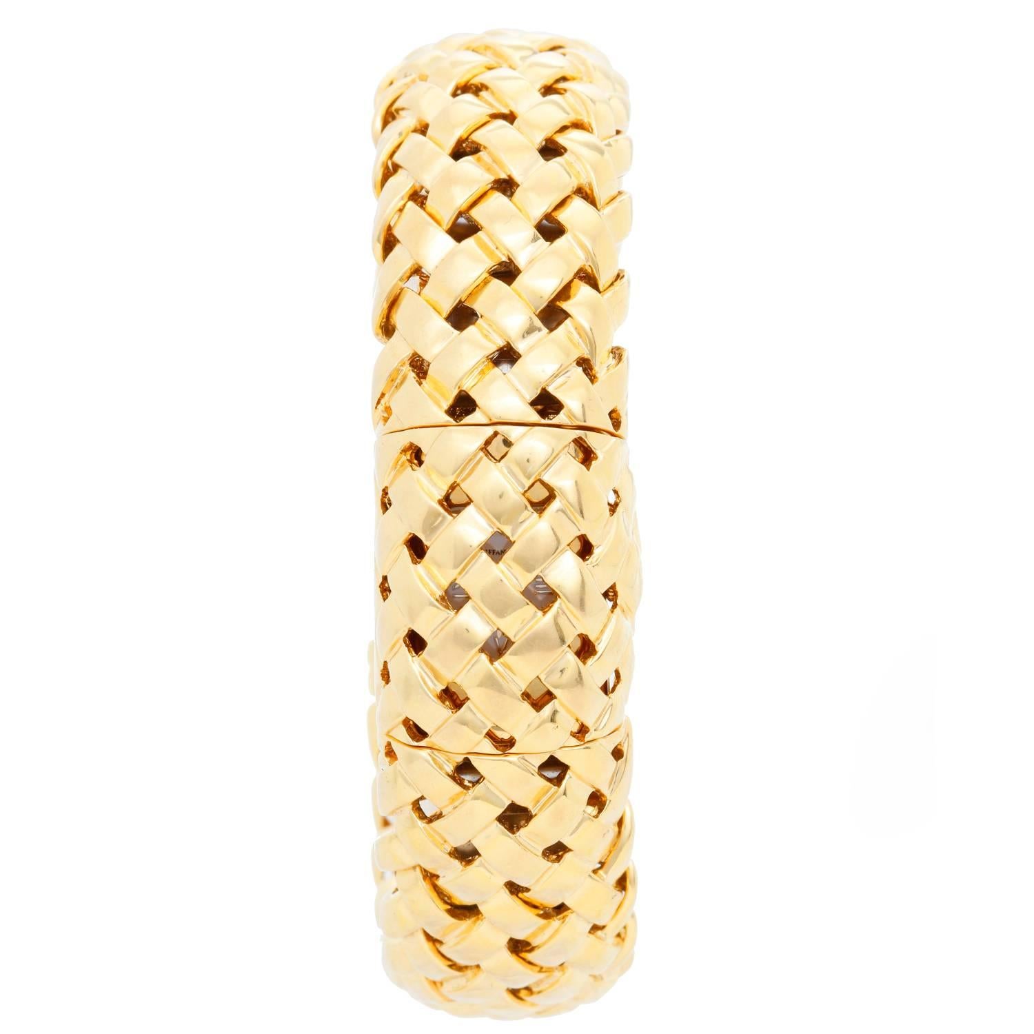 Tiffany & Co. 18K Cuff Yellow Gold Watch -  Quartz. 18K Yellow Gold ( 20 mm ). White dial with Roman numerals at 12, 3, 6, and 9 o'clock. 18K Yellow Gold  Heavy Mesh Cuff  Bracelet. Pre-owned with Tiffany box. Signed Tiffany & Co.