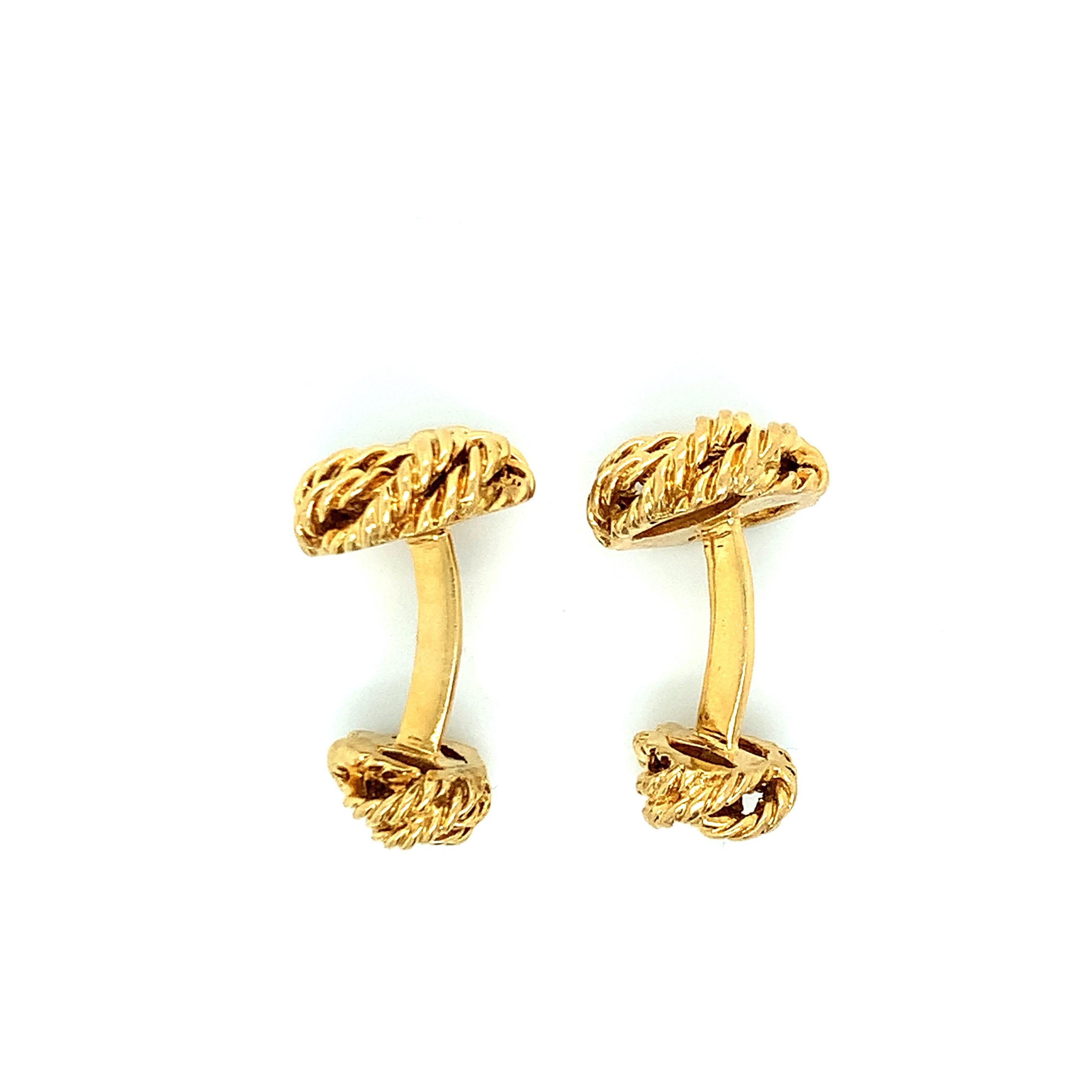 Tiffany & Co. 18 karat yellow gold cufflinks with ropes motif. The ropes' sizes on both ends are not the same. Both are marked: Tiffany & Co. / 18K. Total weight: 13.8 grams. Width: 1.4 cm. Length: 2.5 cm. 