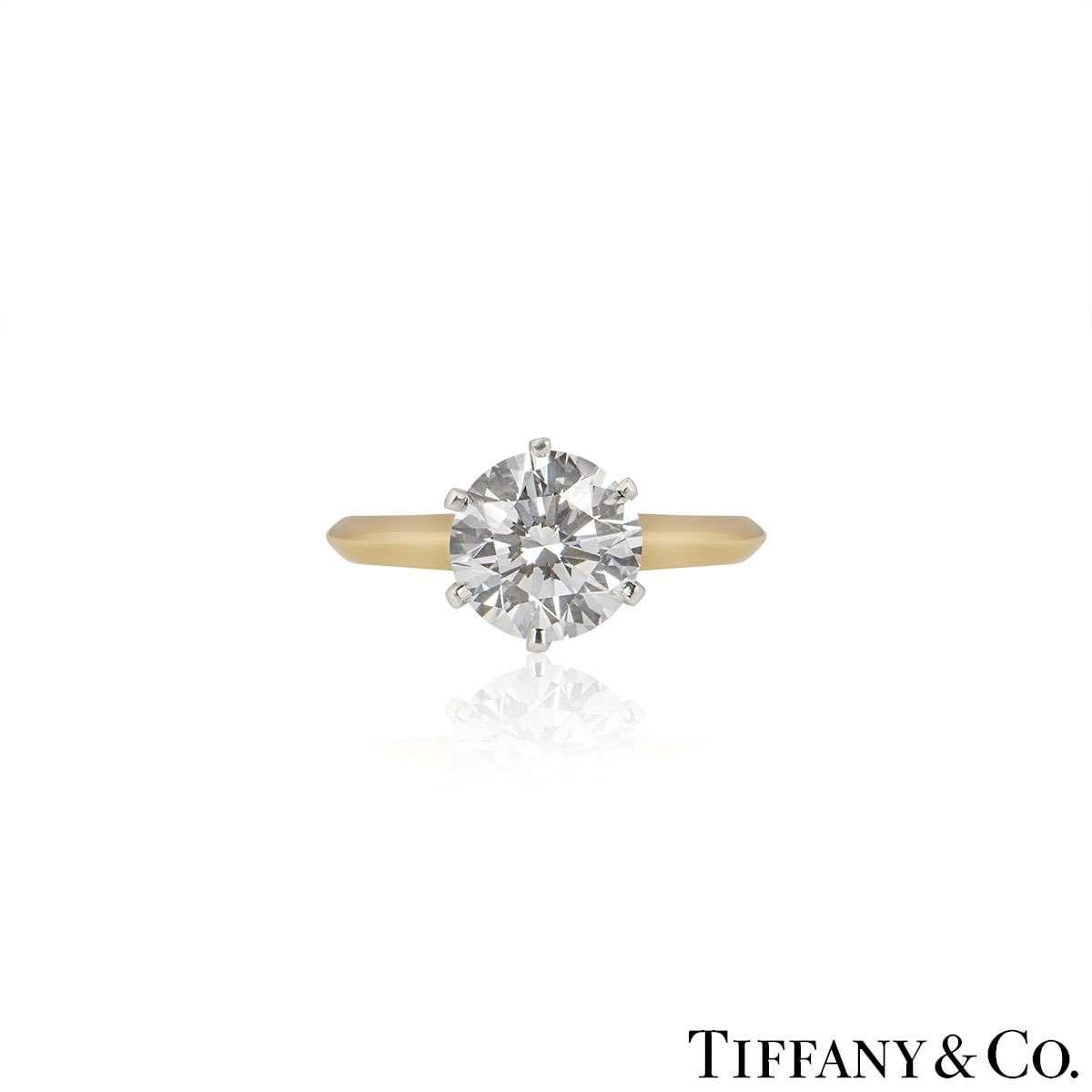 A beautiful 18k yellow gold diamond ring by Tiffany & Co. from The Setting collection. The ring comprises of a round brilliant cut diamond in a 6 claw setting with a weight of 2.05ct, D colour and VVS2 clarity. The ring is currently a size UK L / EU