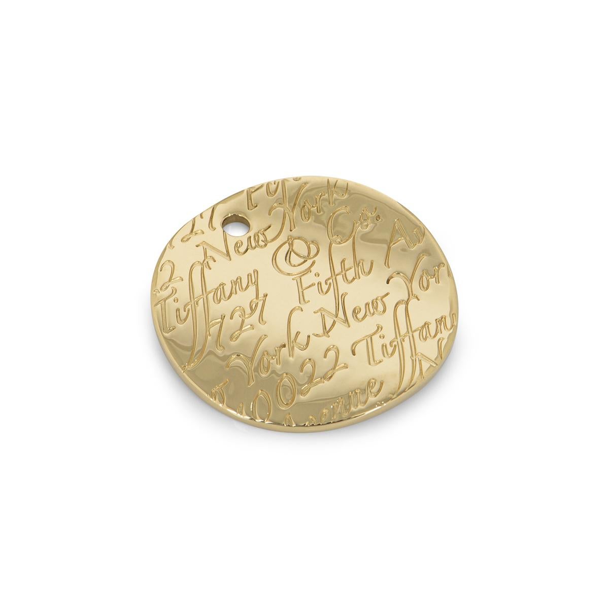 Tiffany & Co. Pendentif Notes rondes en or jaune Excellent état - En vente à London, GB