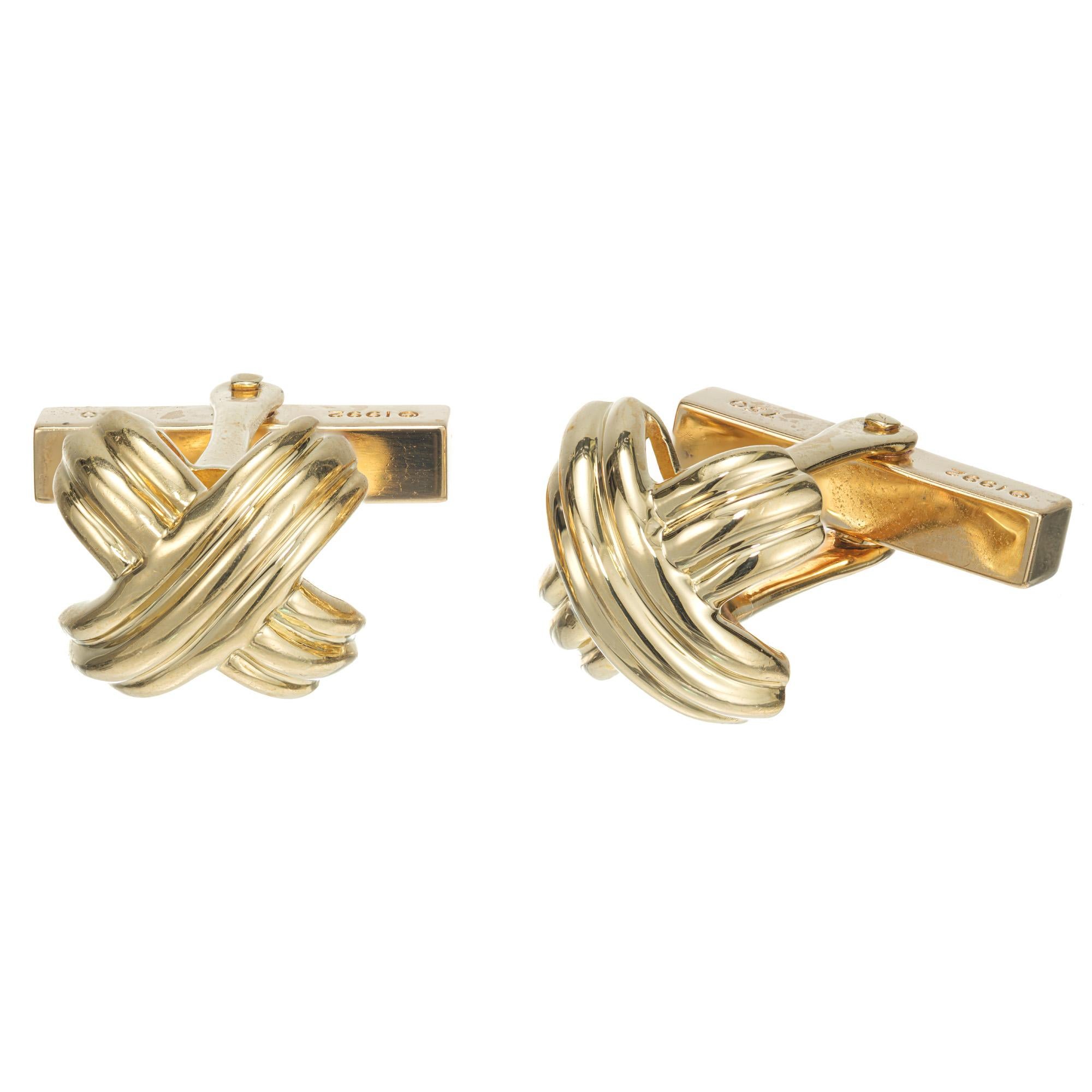 Solid 18k yellow gold Iconic Tiffany & Co X design cufflinks.

18k yellow gold
Stamped: 750
Hallmark: Tiffany + Co
14.4 grams
Top to bottom: 13.7mm or .54 Inches
Width: 13mm or .5 Inch
Depth or thickness: 6.5mm
