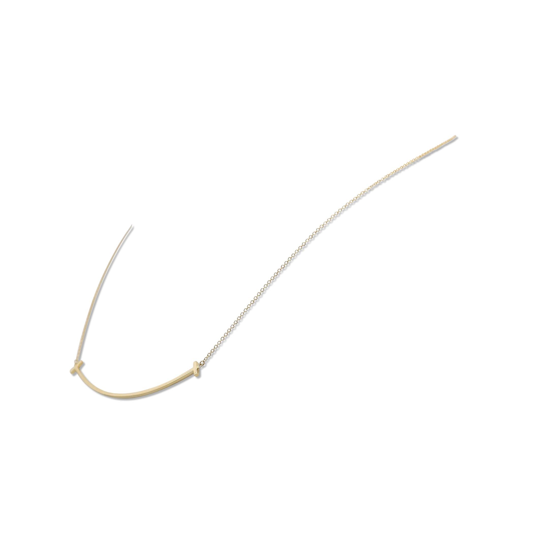 Authentic Tiffany & Co. 18 karat yellow gold 'smile' necklace from the Tiffany T collection. A timeless design that is a tribute to the world's most universal gesture, the smile. The necklace measures 18 inches in length. Signed Tiffany & Co.,