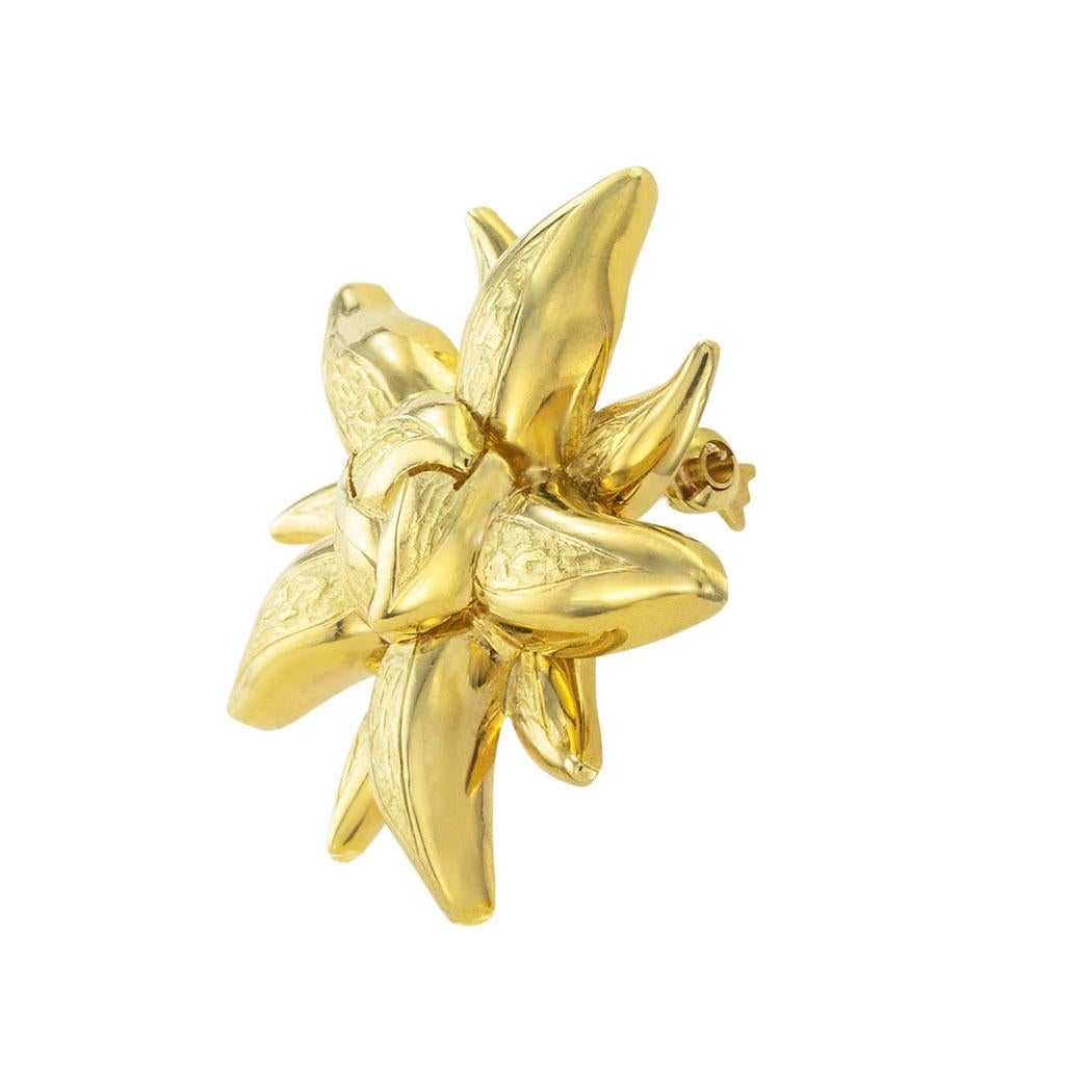 Tiffany & Co yellow gold sunburst brooch circa 1980. 

SPECIFICATIONS:

METAL:  18-karat yellow gold.

WEIGHT:  9.9 grams.

HALLMARKS:  signed Tiffany & Co.

MEASUREMENTS:  approximately 1-5/8” (3.50 cm) overall diameter.

CONDITION:  high