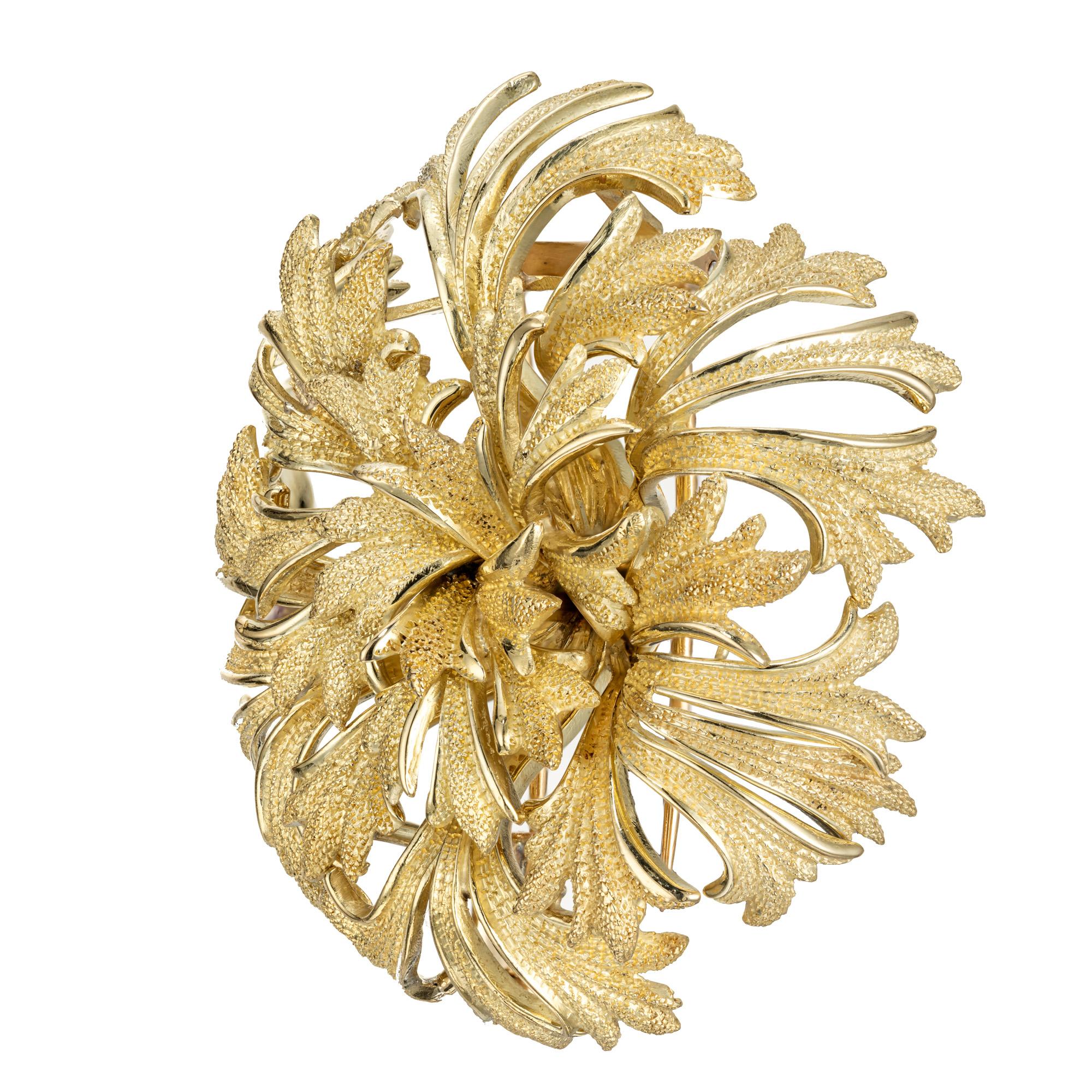 Tiffany & Co 18k gold brooch designed with detailed petals enhanced with a Florentine texture.  circa 1960's

18k yellow gold 
Stamped: 18k
Hallmark: Tiffany & Co
30.3 grams
Top to bottom: 43.3mm or 1.70 Inches
Width: 48.7mm or 1.9 Inches
Depth or