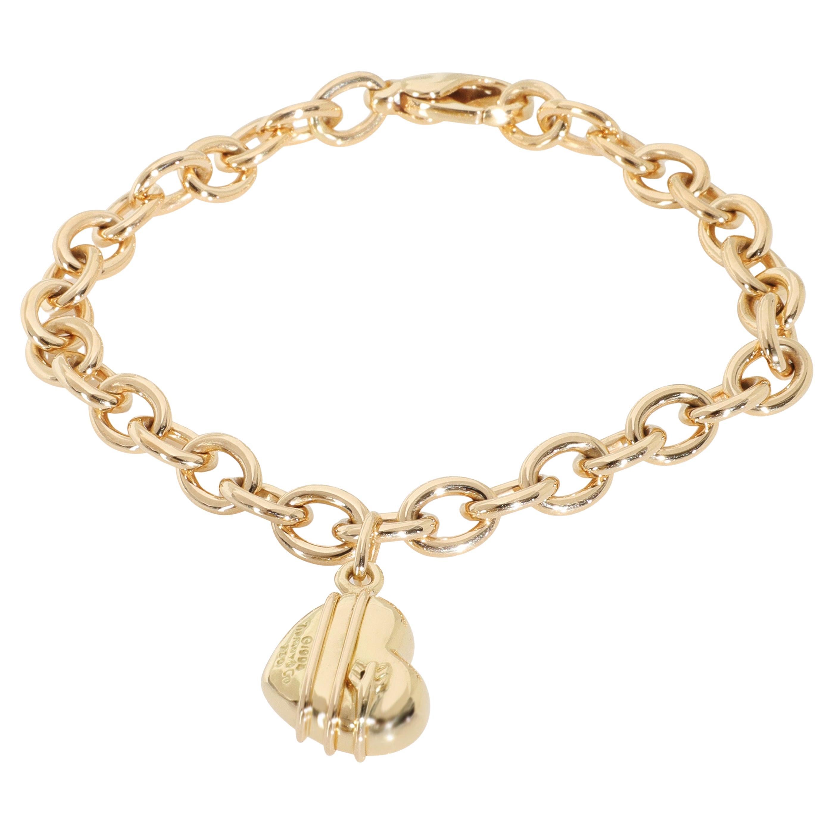 Tiffany
Co. Oro giallo Bracciale con charm a forma di cuore con freccia di Cupido vintage